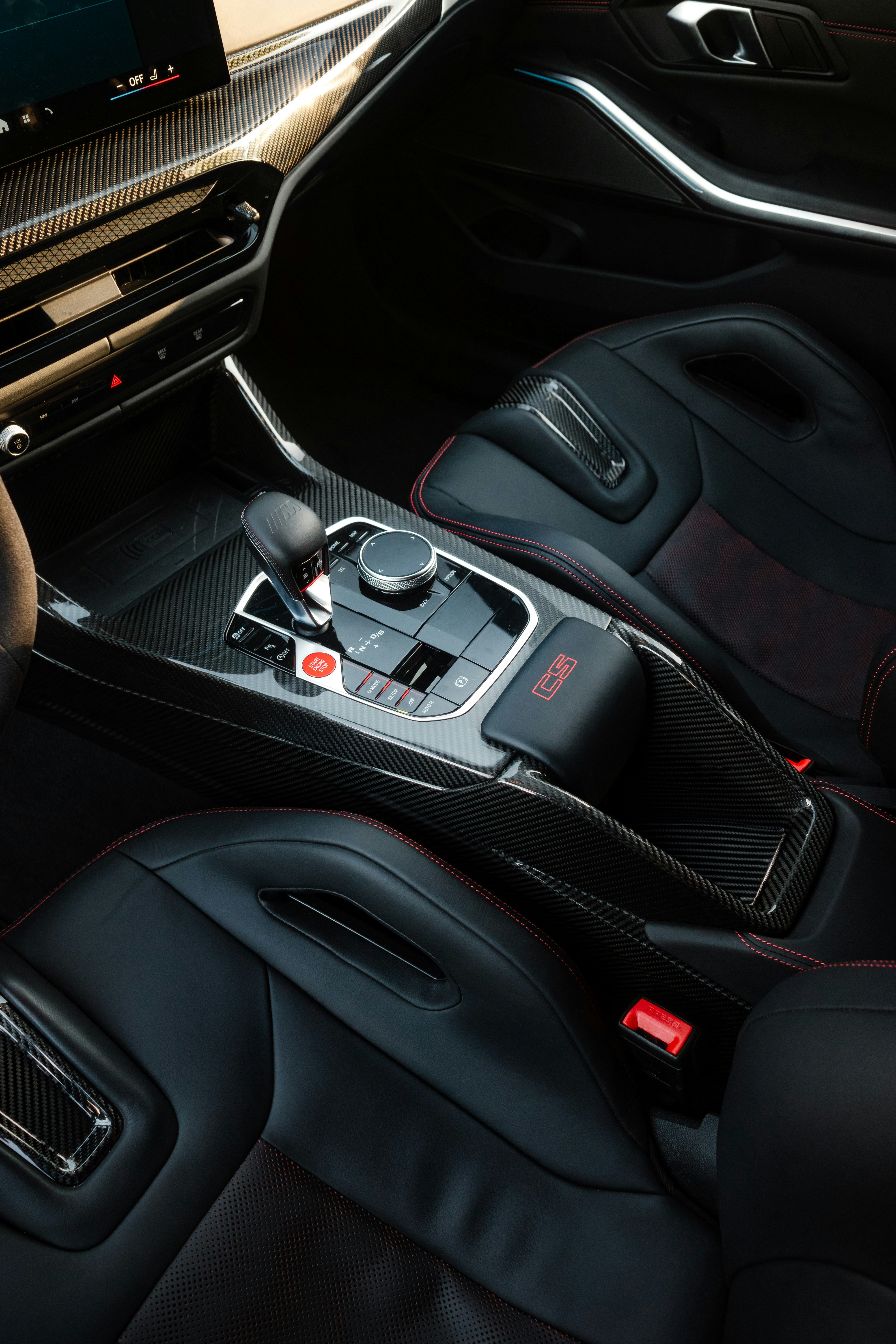 Modern car interior with leather seats and carbon fiber trim
