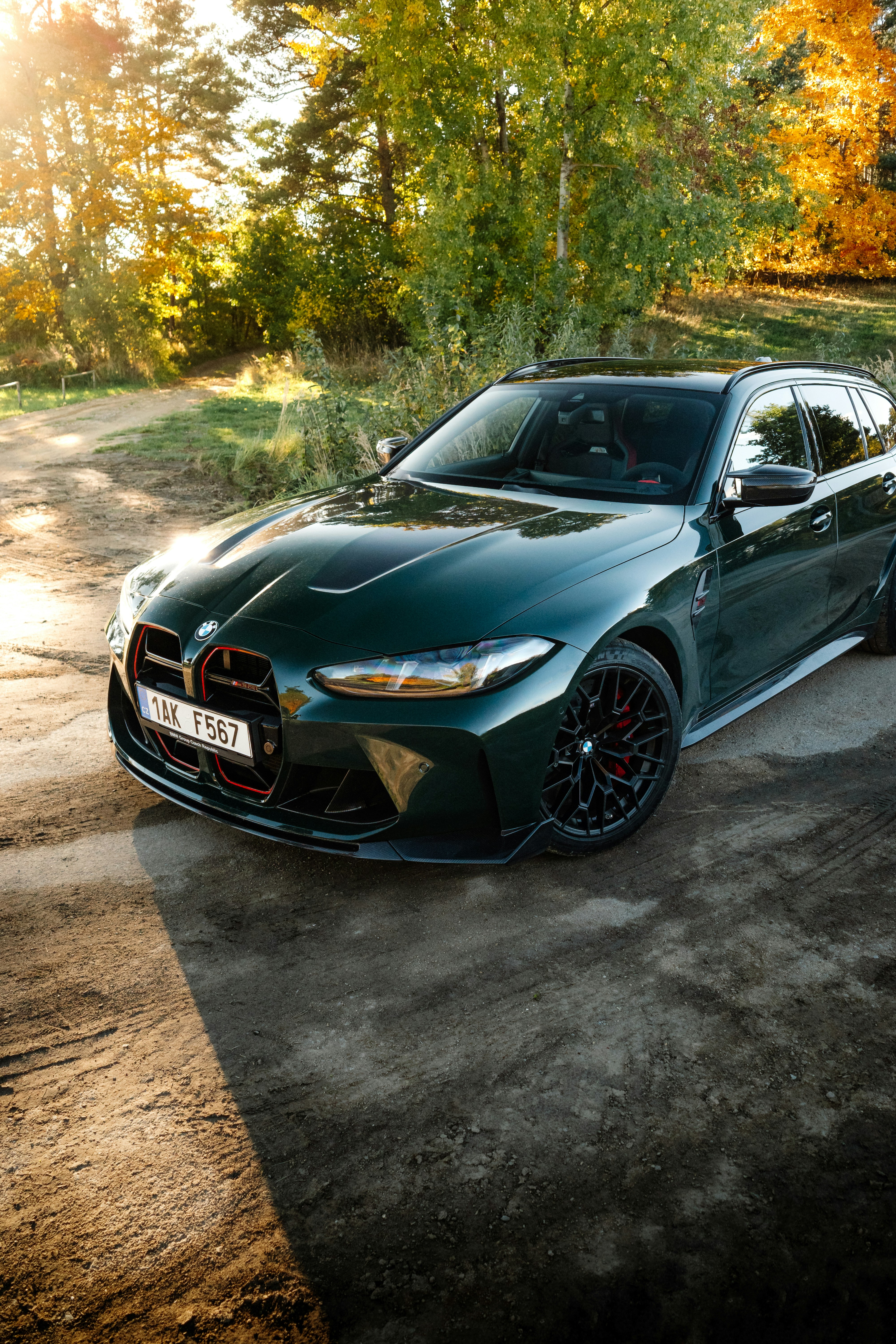 Dark green BMW m3 touring parked outdoors