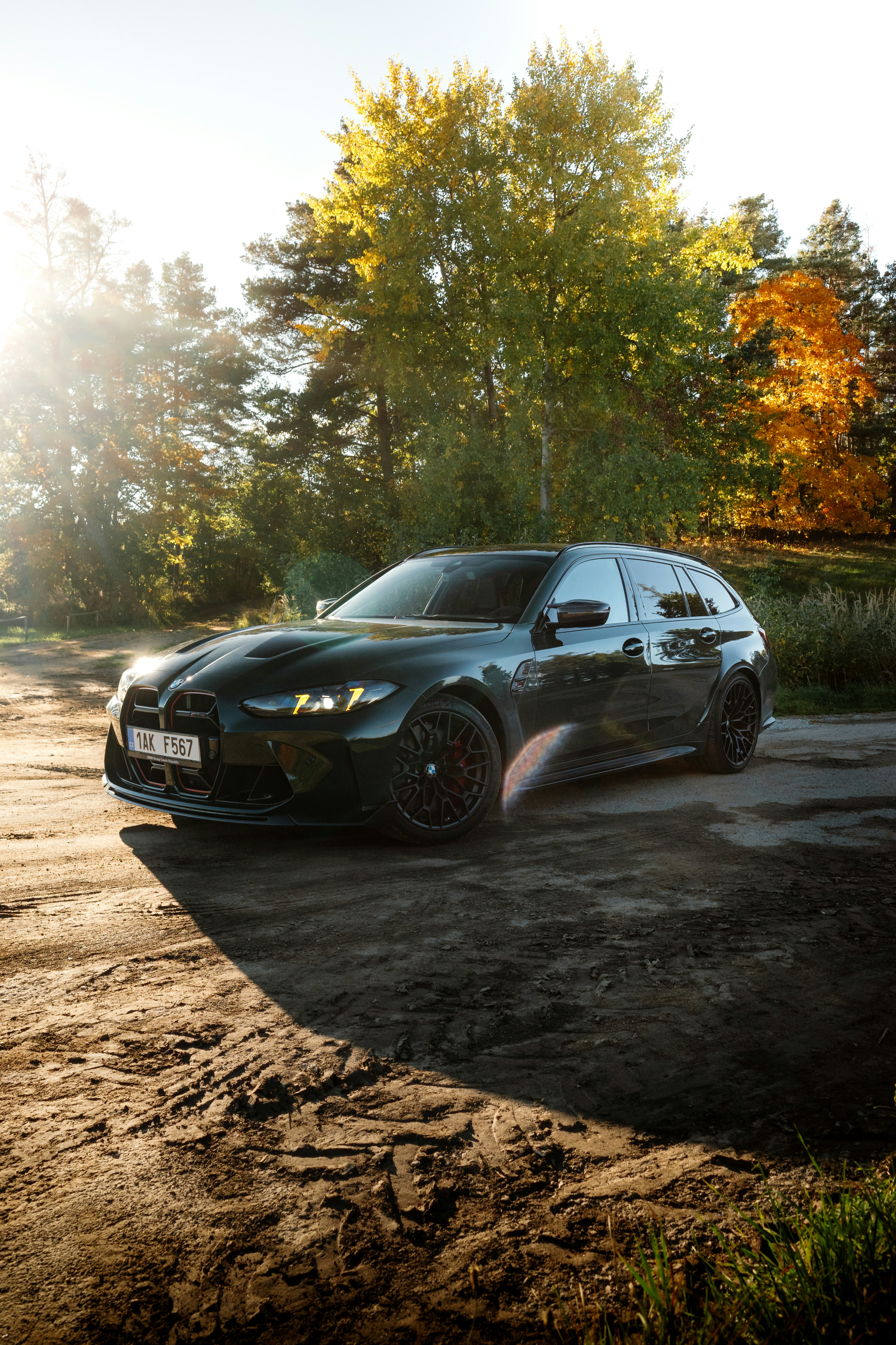 Dark green BMW m3 wagon parked outdoors