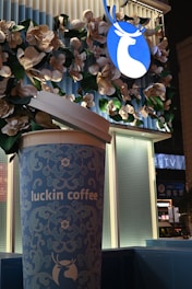 Luckin coffee cup with floral decoration and logo