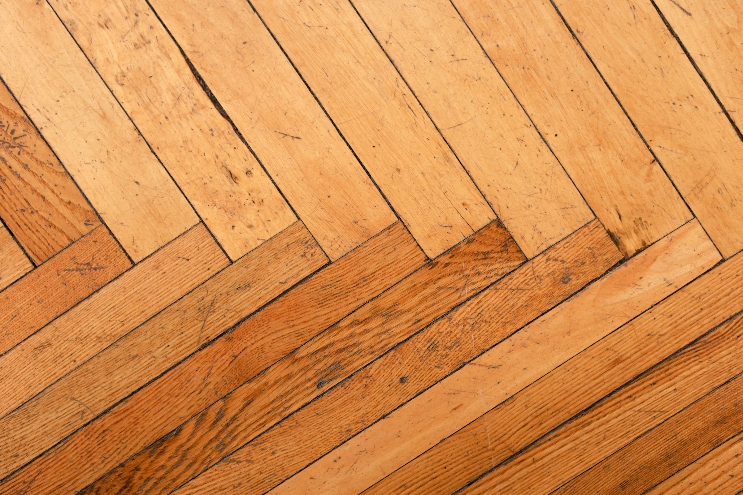 Sweeping herringbone hardwood floor in warm light