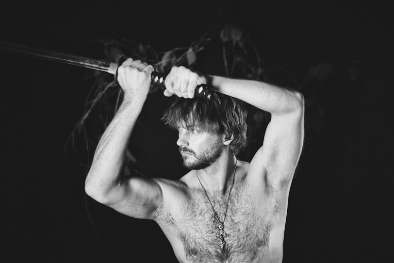 Man holding sword with determination