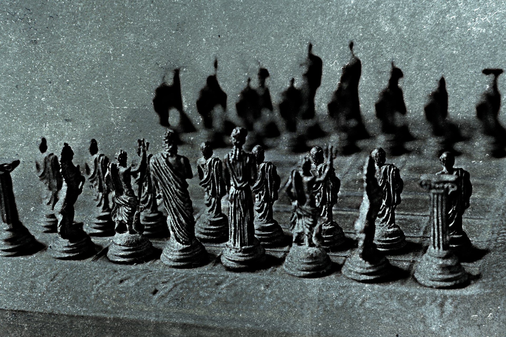 Ancient chess set with detailed figures on board