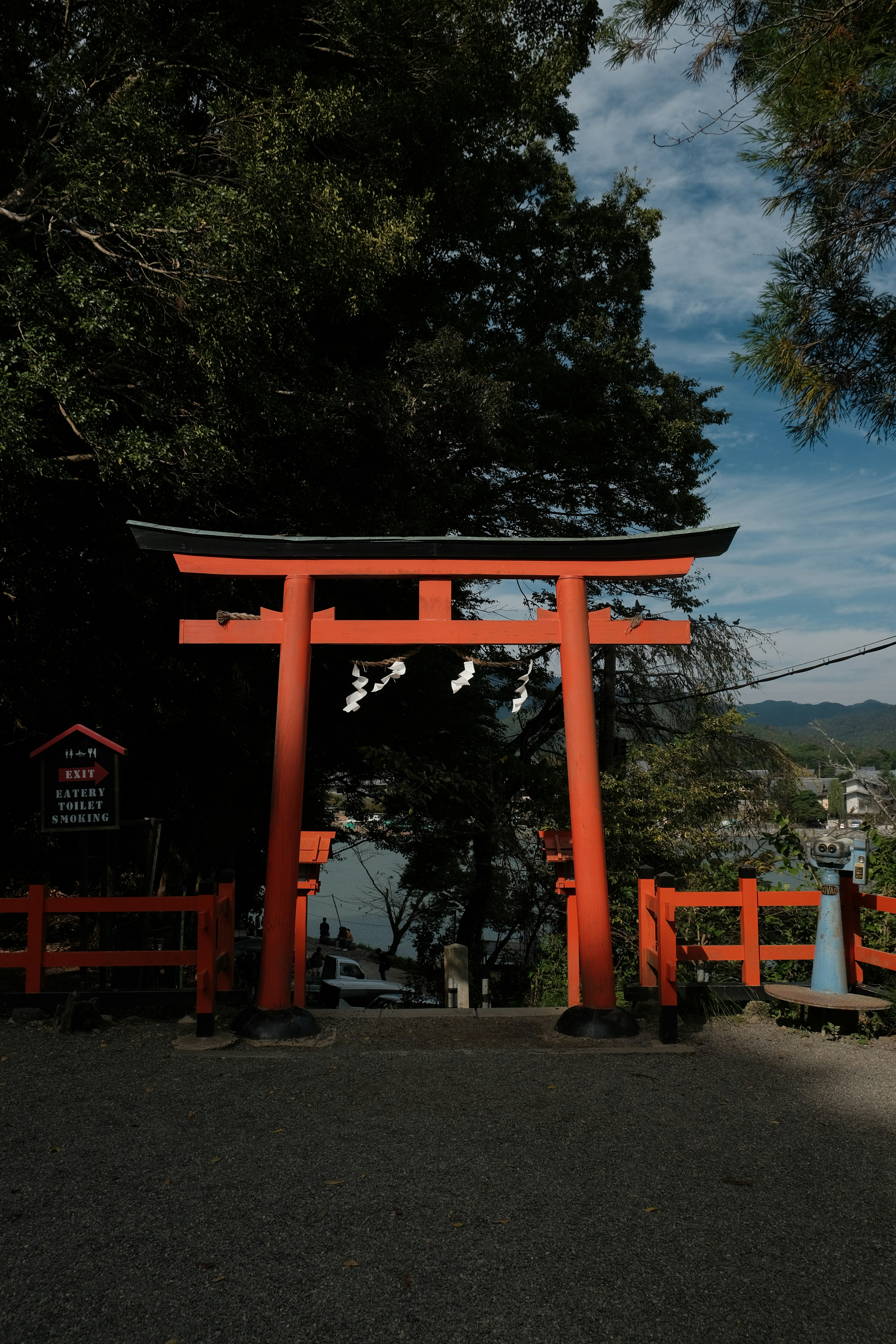 Red torii gate in a forest setting