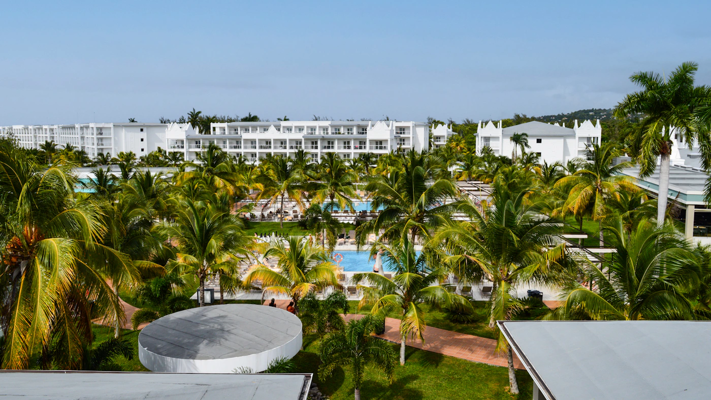 Family-friendly tropical resort with pools and palm trees