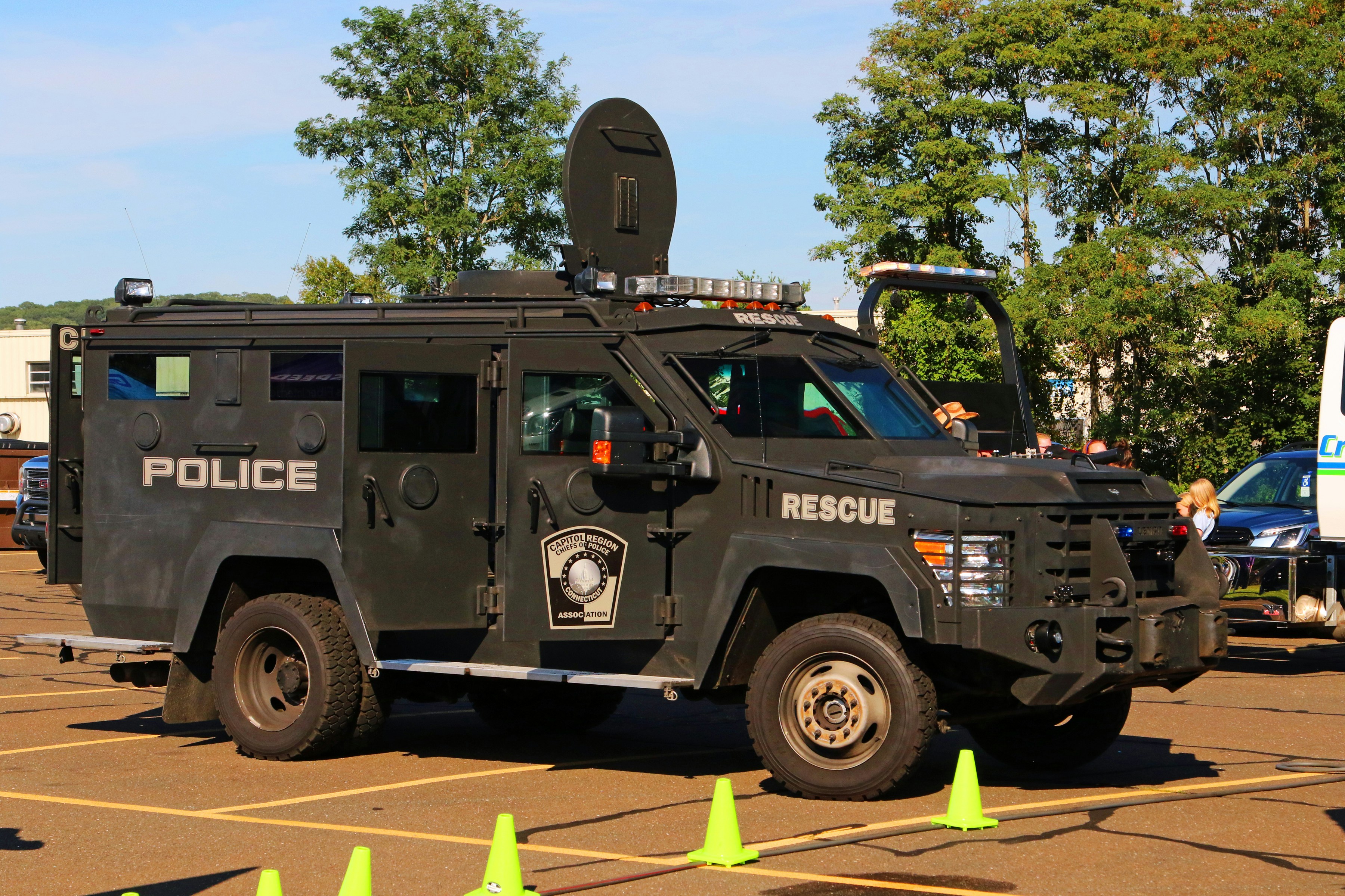 police officers operating mobile tactical command van with communication antennas