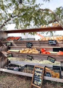 Fresh produce displayed on a rustic wooden stand.