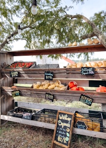 Fresh produce displayed on a rustic wooden stand.