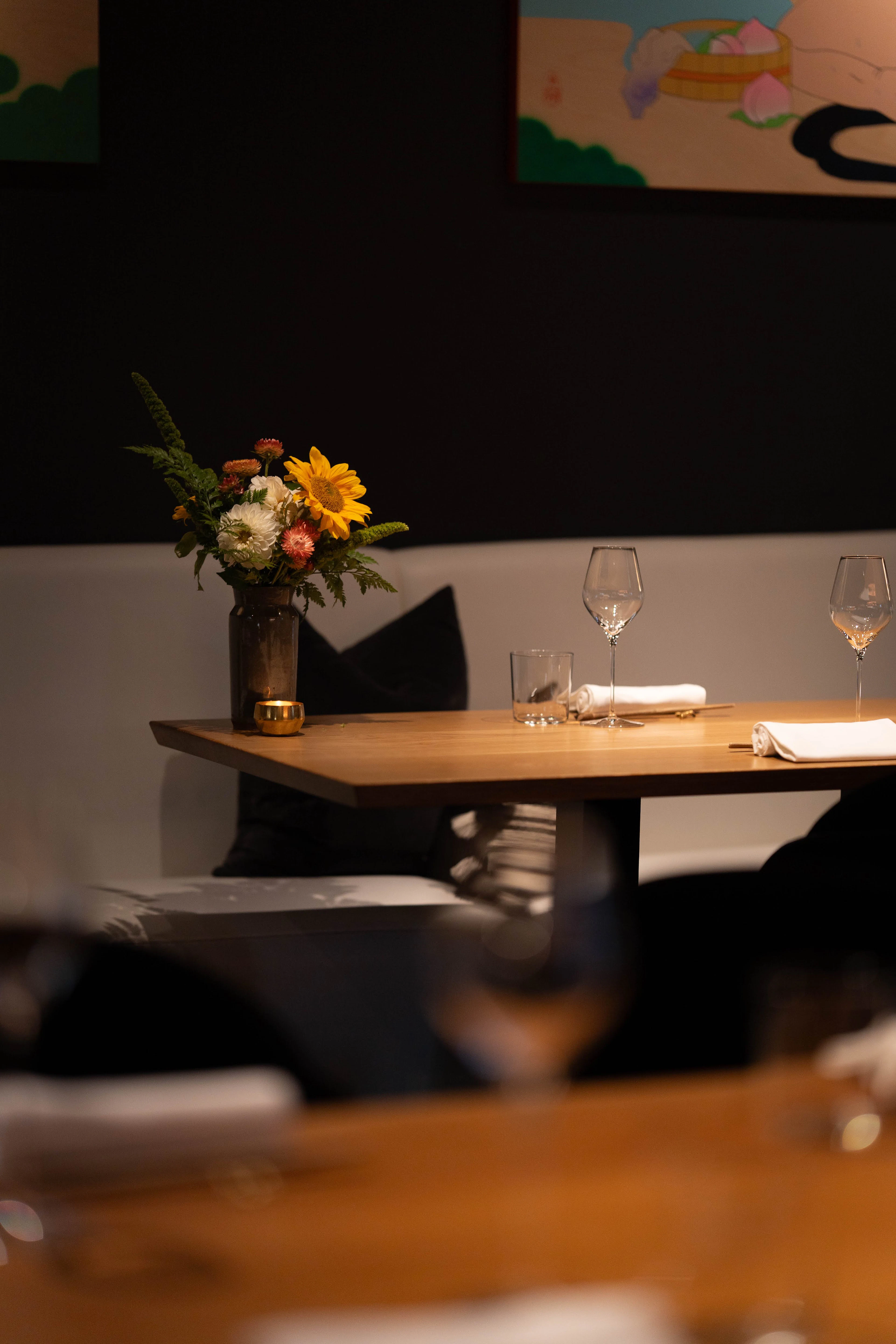 Elegant table set with a floral centrepiece and candlelight