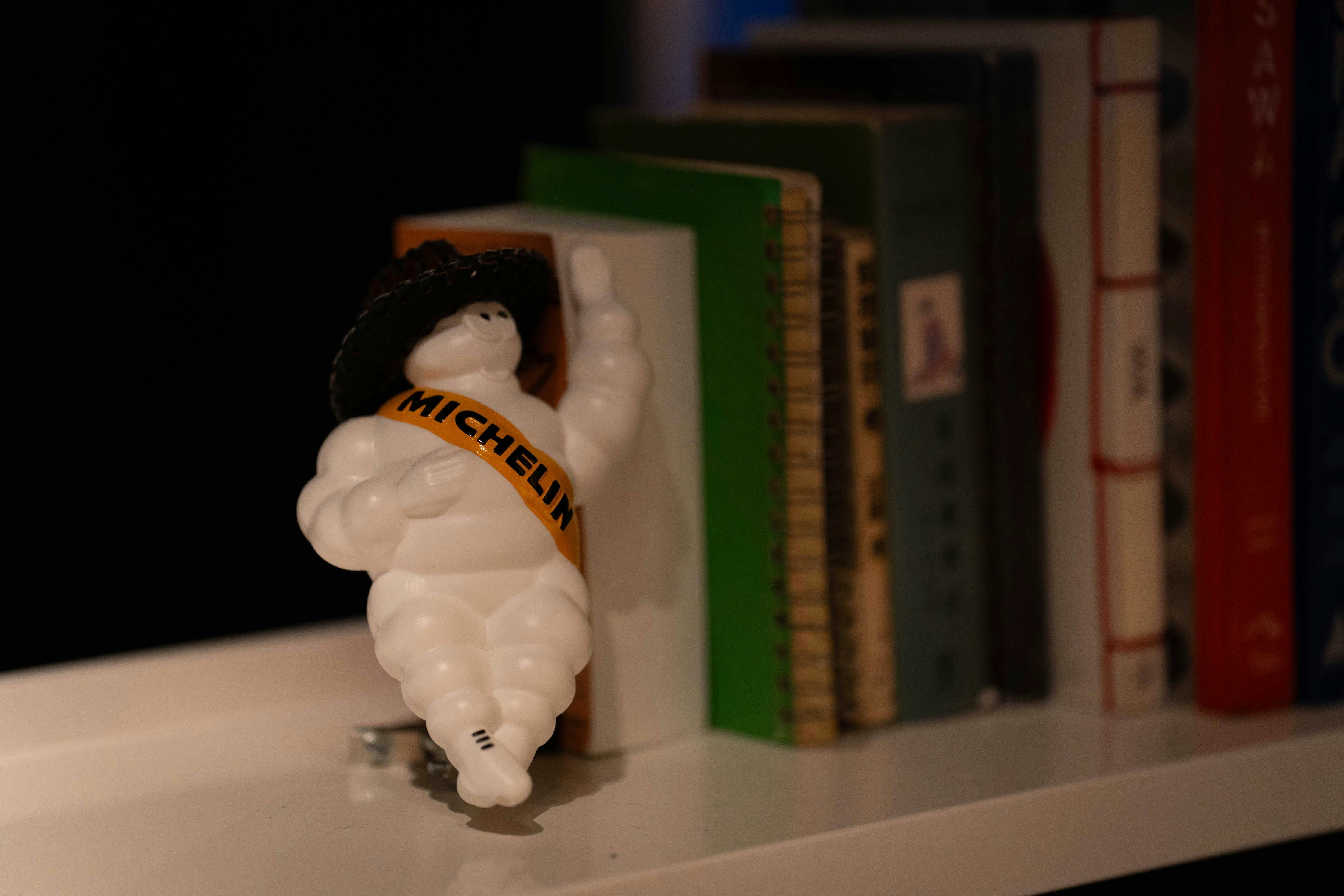 Michelin man figurine on a bookshelf