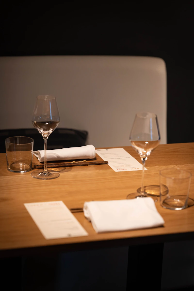 Place settings with wine glasses