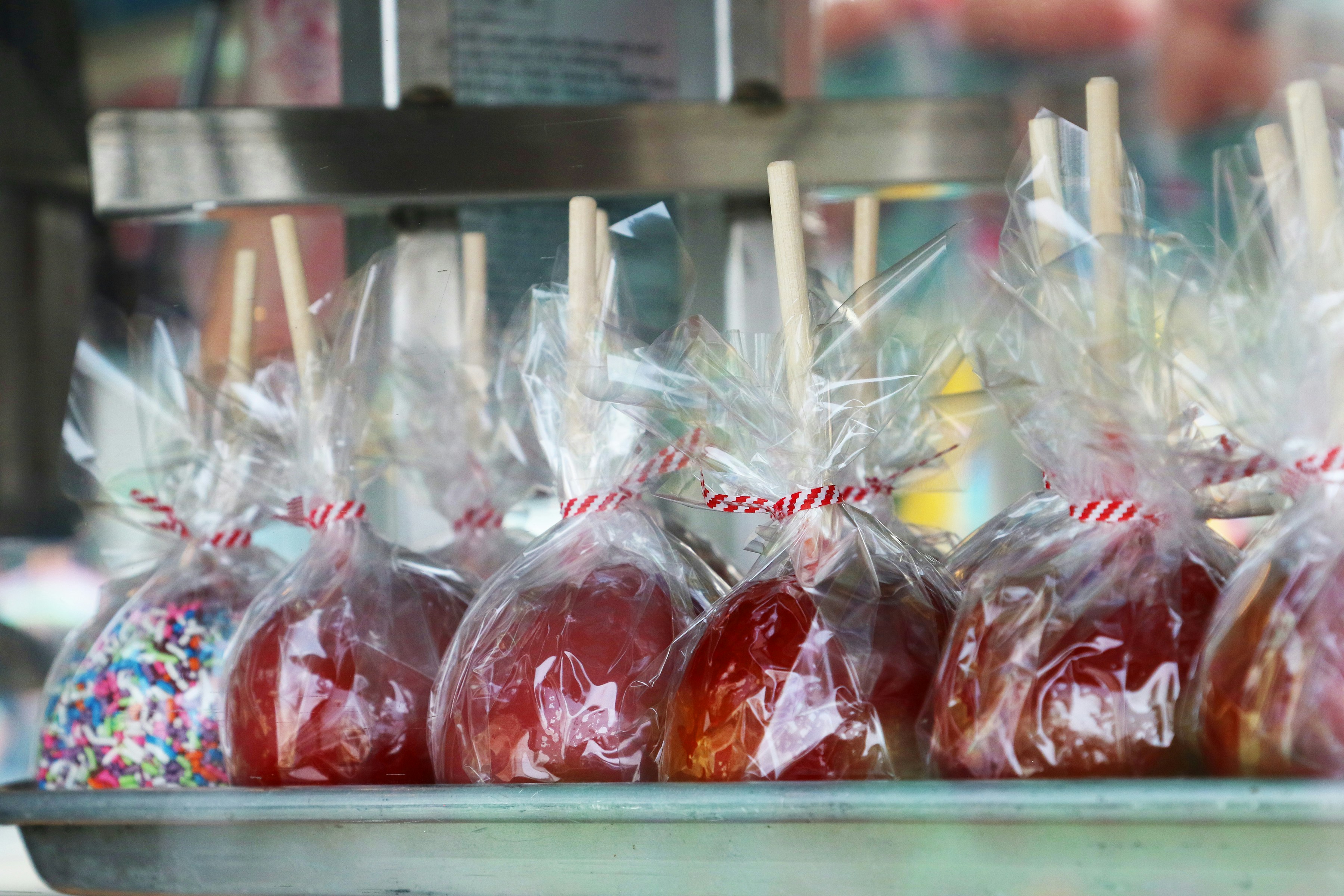Candy apples on sticks, sticks wrapped in plastic