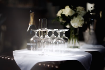 Champagne bottle and glasses with flowers