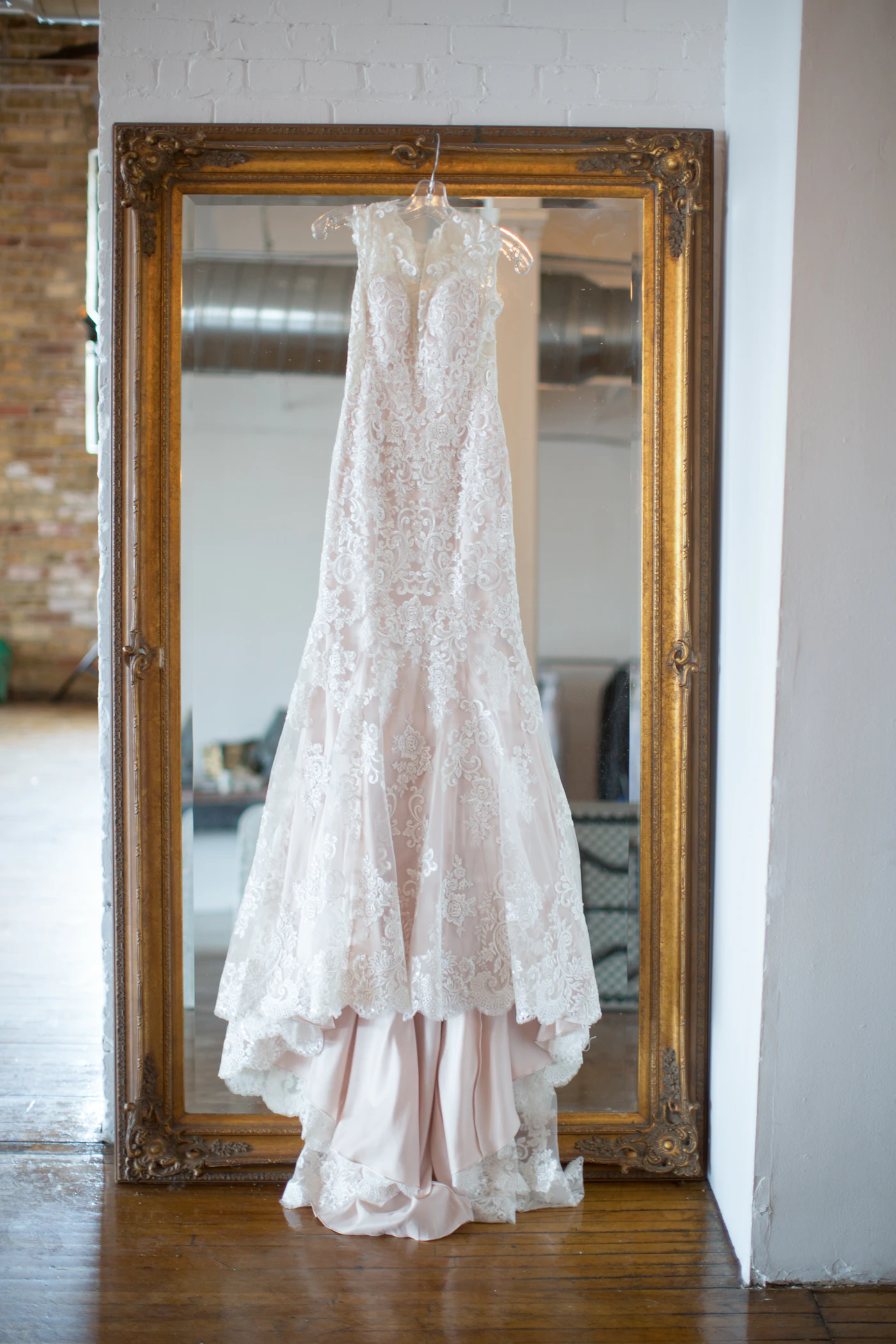 Trend forecast: 2025 wedding dress silhouettes — Close-up of intricate floral appliqués and a structured corset bodice on a modern wedding dress.
