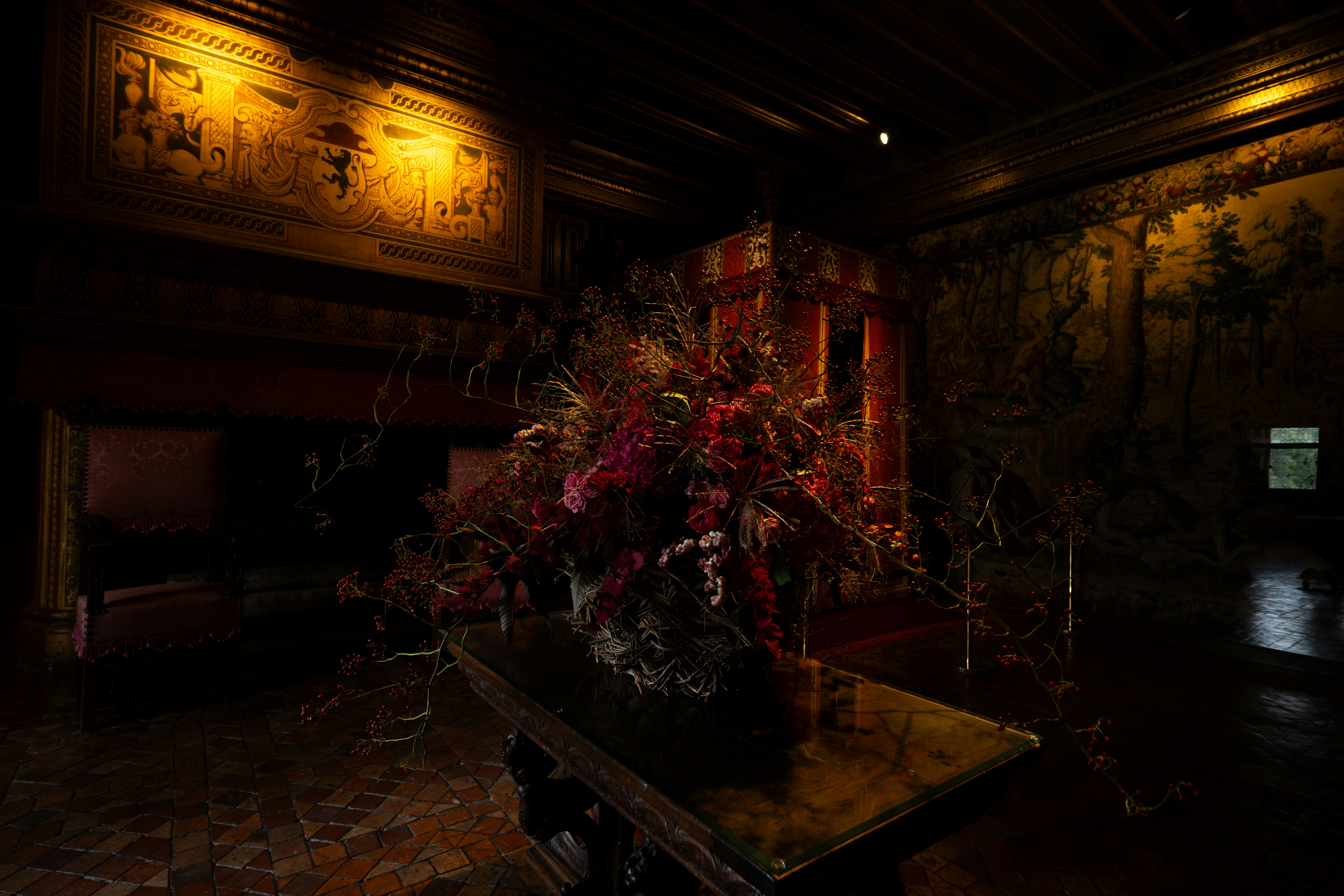 Dark interior with floral arrangement