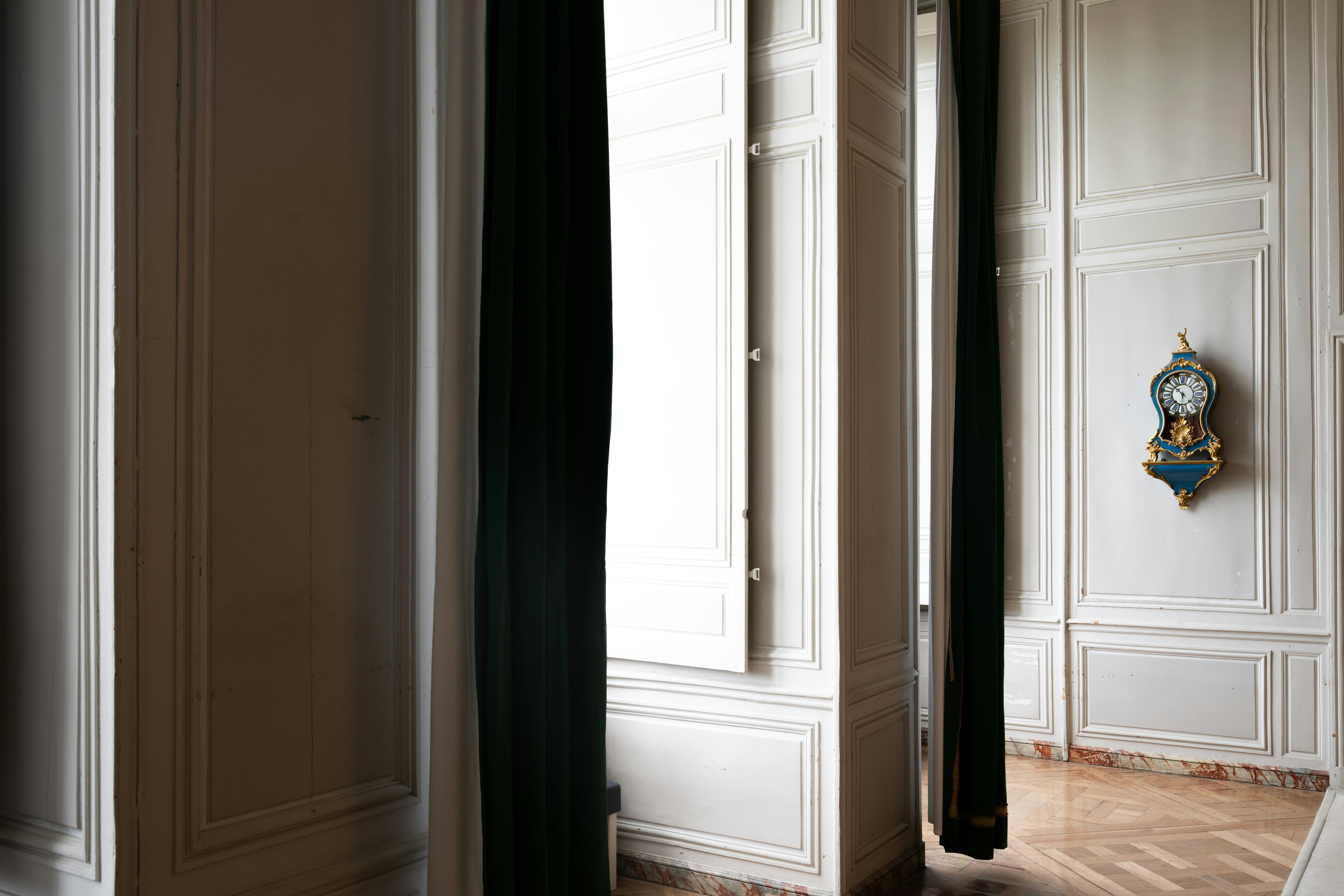 Ornate hallway with a clock on the wall
