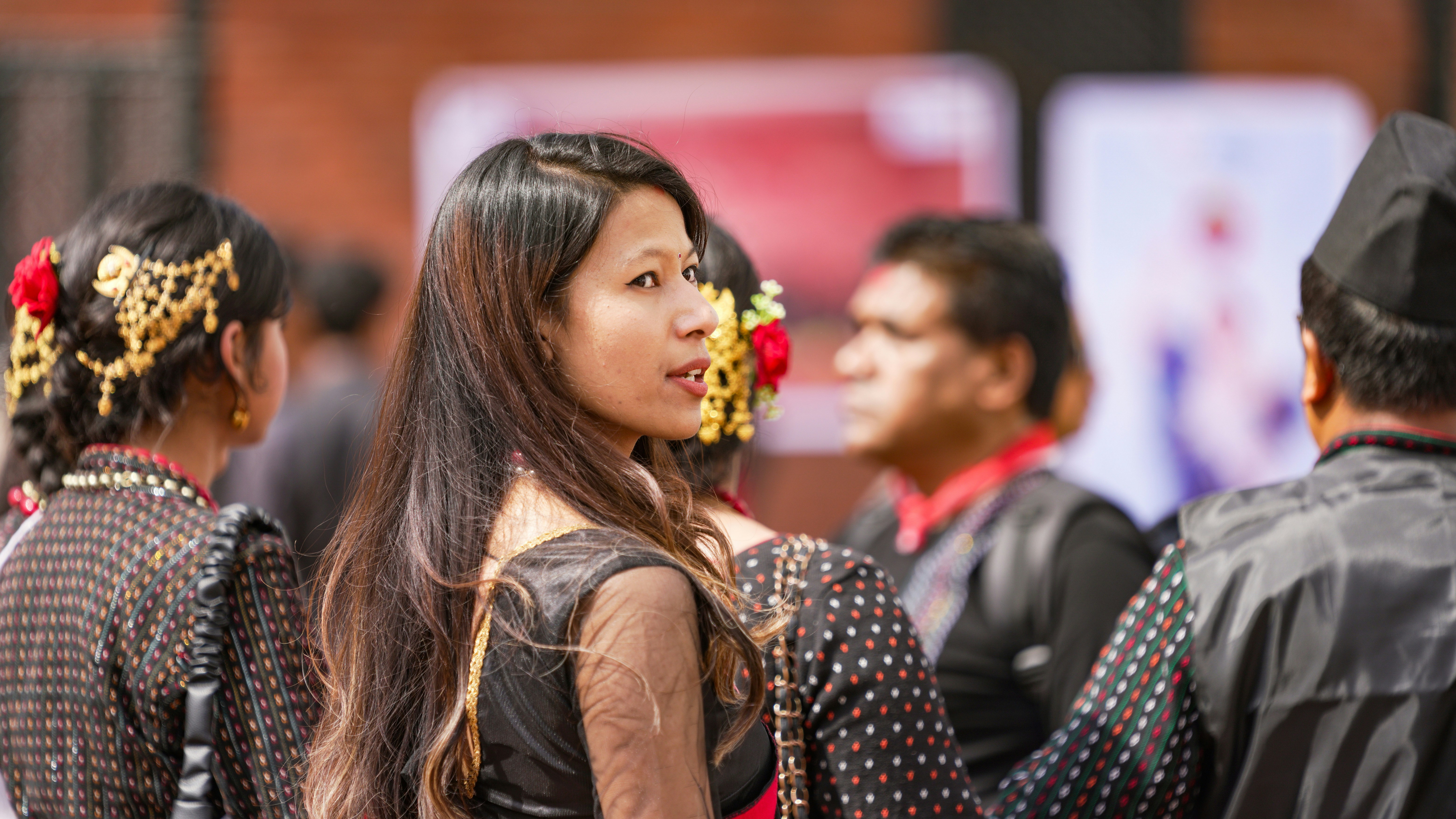 Young woman in traditional attire at an event