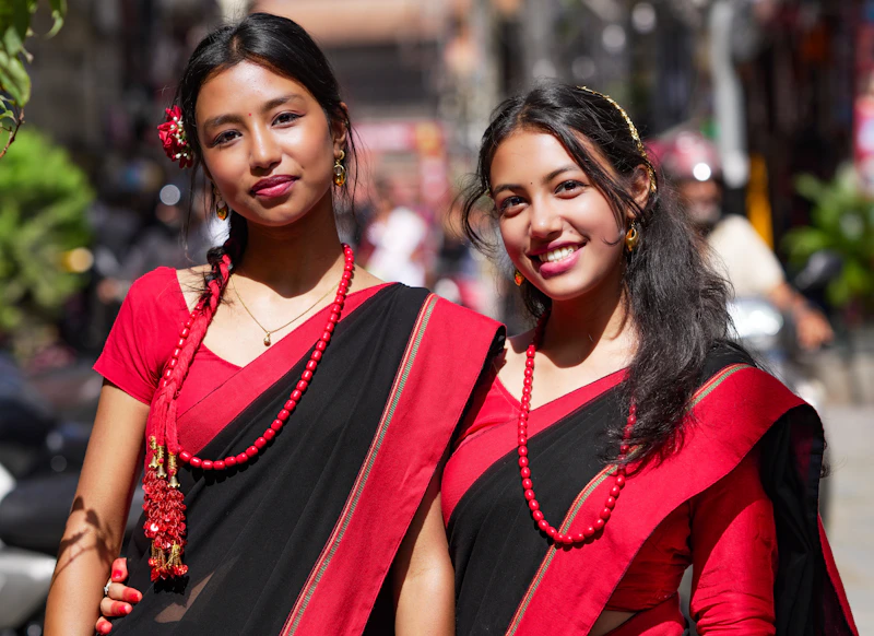 Sophisticated Indian women in traditional saris