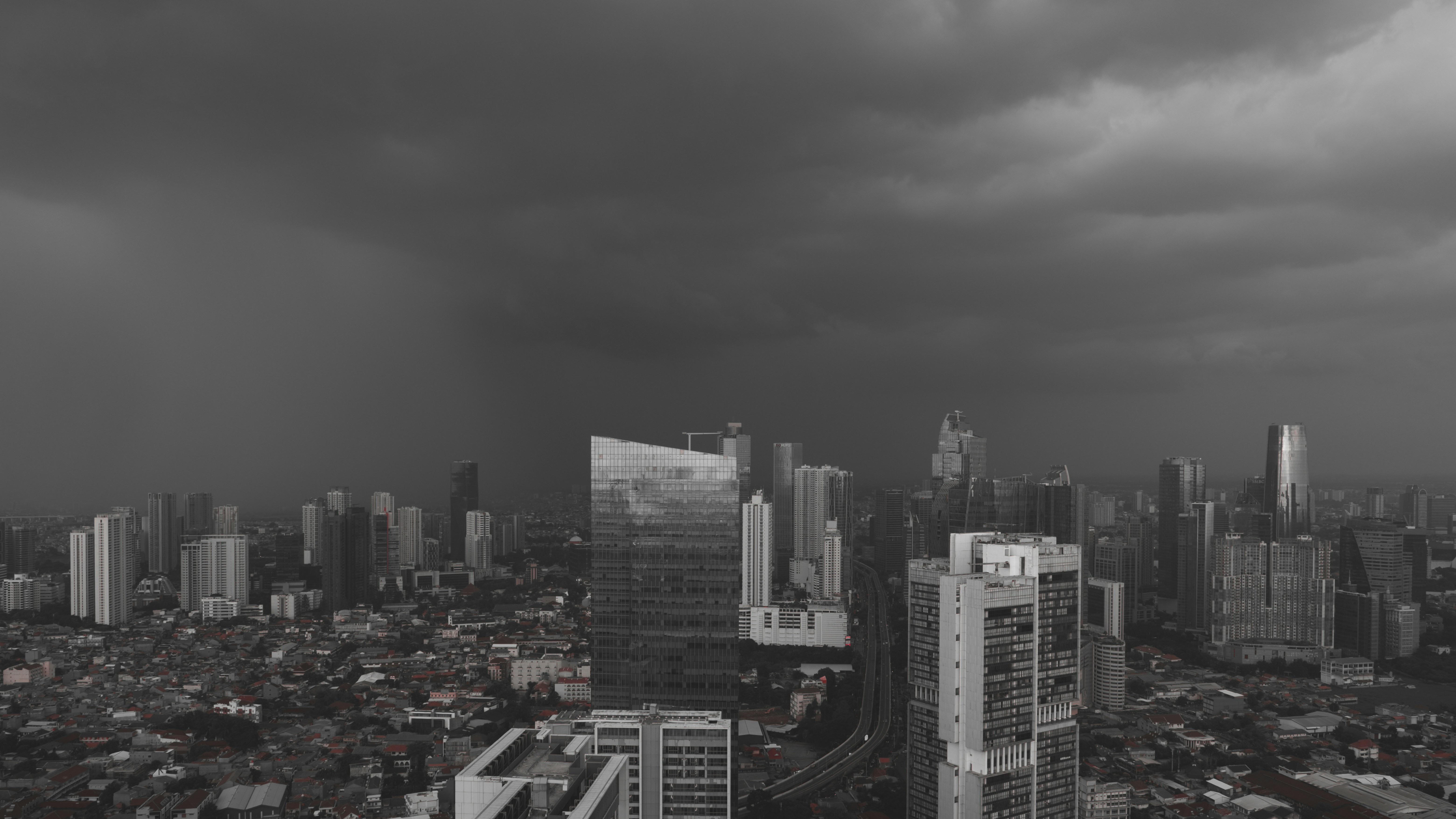 Dark stormy clouds over a cityscape