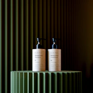 Two bottles of shampoo and conditioner on display.