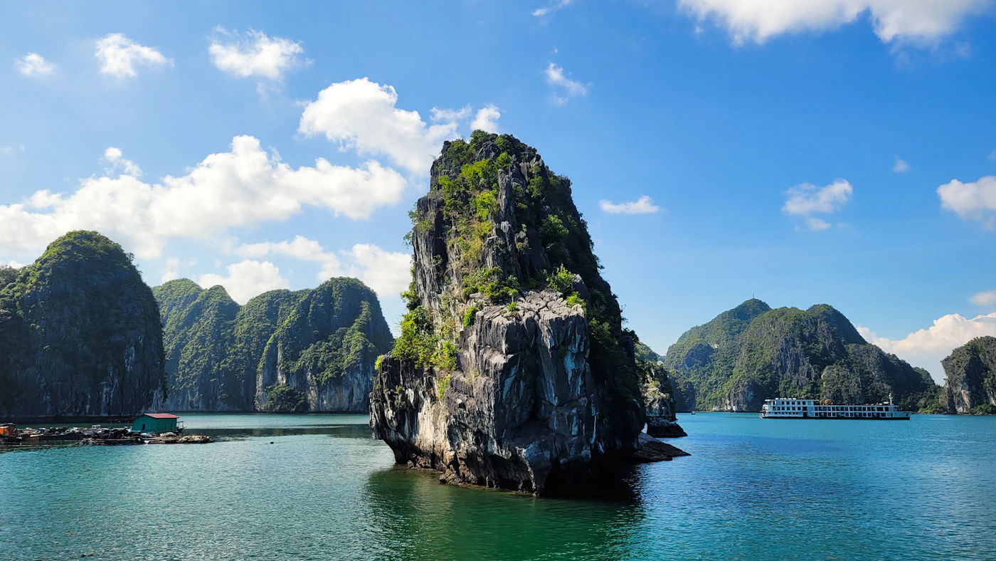 Limestone karst islands rising from emerald waters in Ha Long Bay