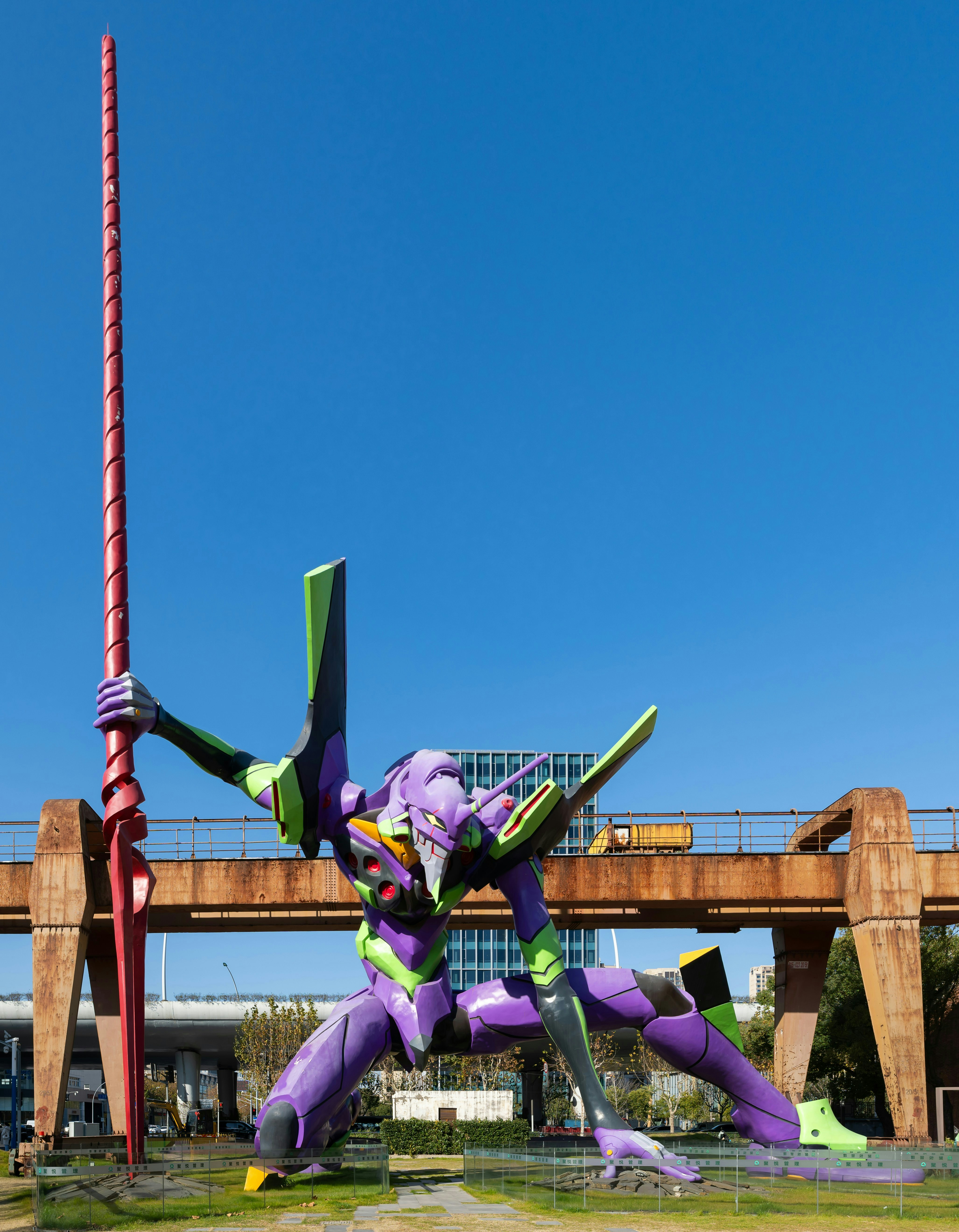 Giant purple and green robot holding a spear