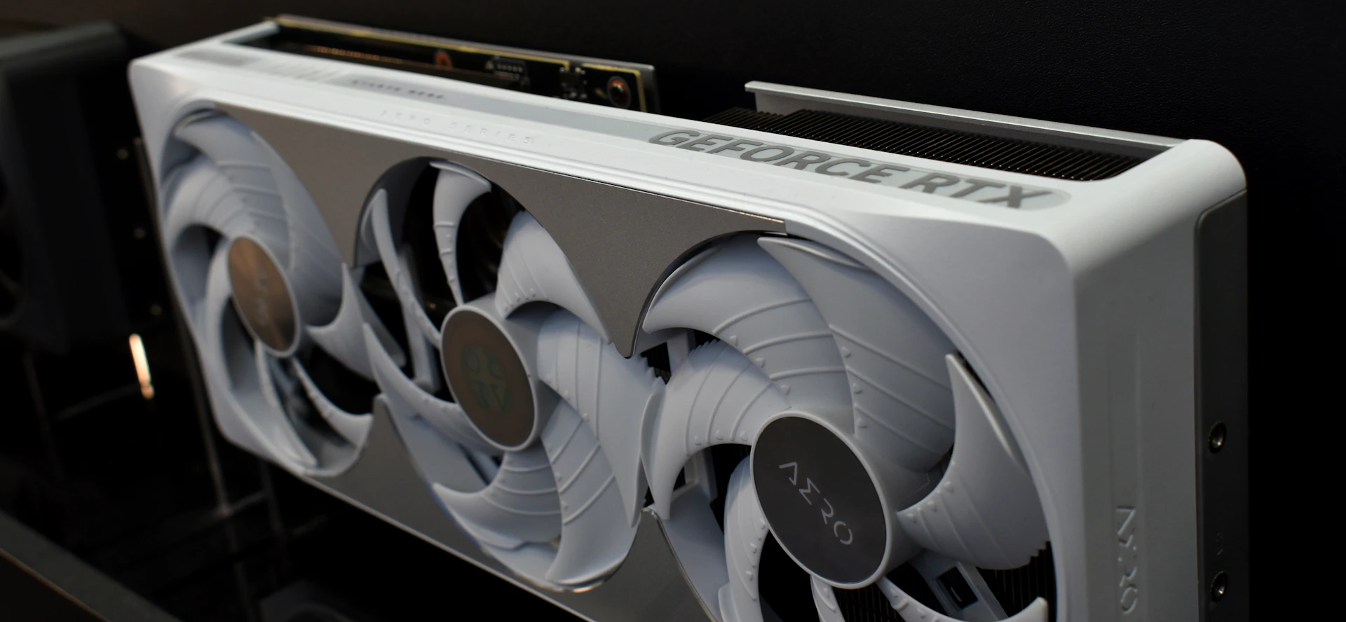 White graphics card with three fans and rtx logo