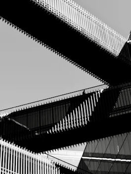 Modern architectural bridges against a clear sky