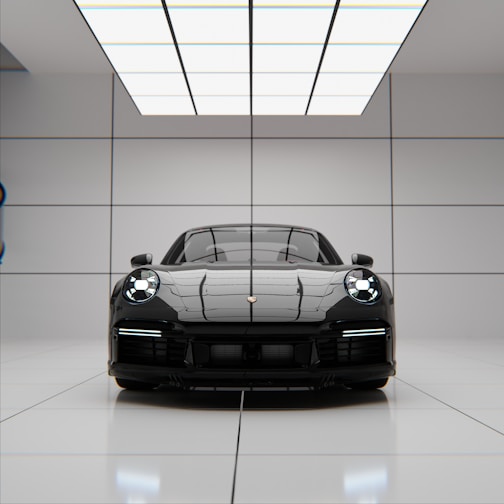 A sleek black sports car parked in a modern showroom.