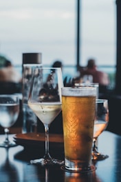 Glasses of beer and wine on a table