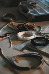 Various coils of wire and tools on a table