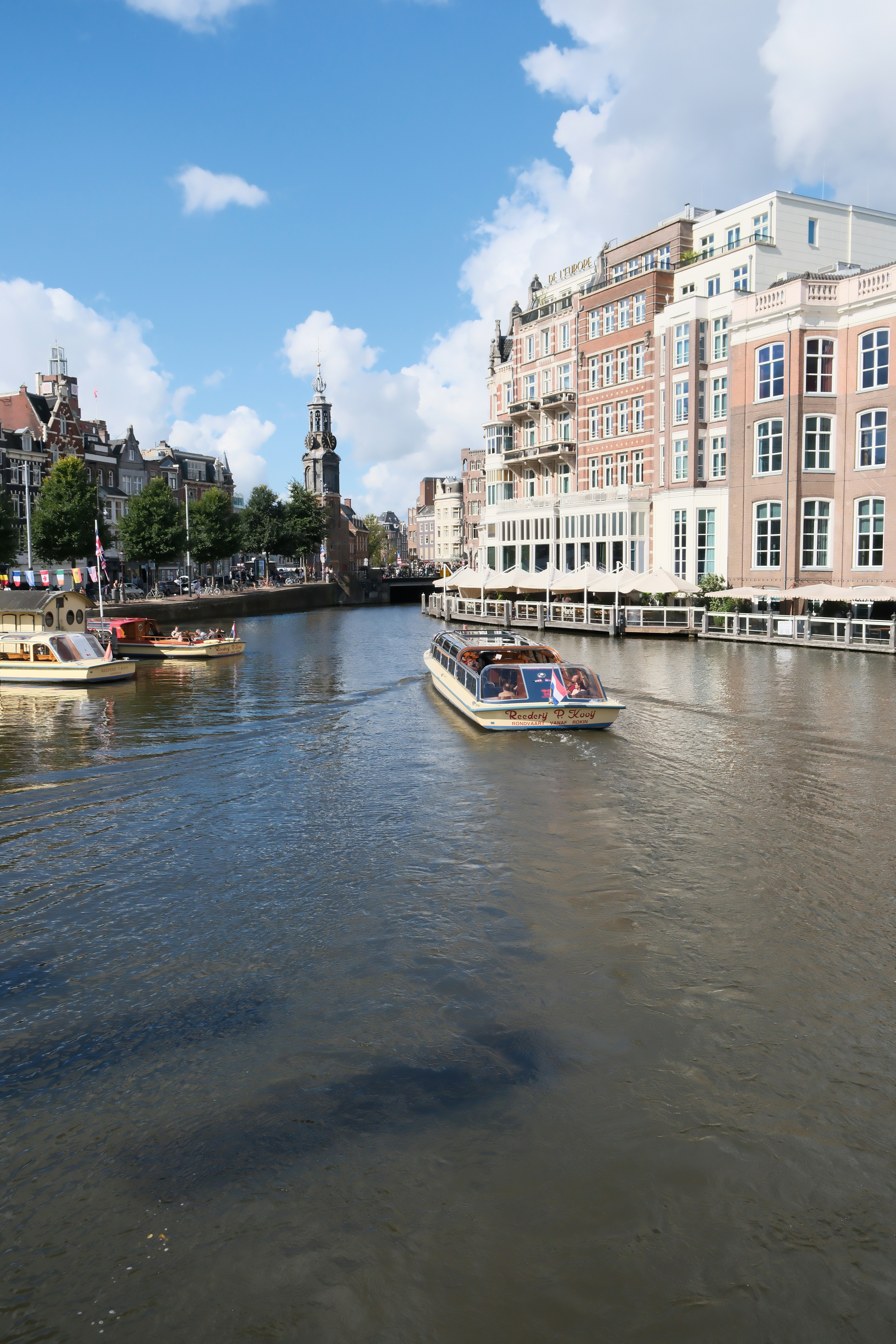Boats on a canal in a european city. - boats-on-a-canal-in-a-european-city-DVP8ehvTApk