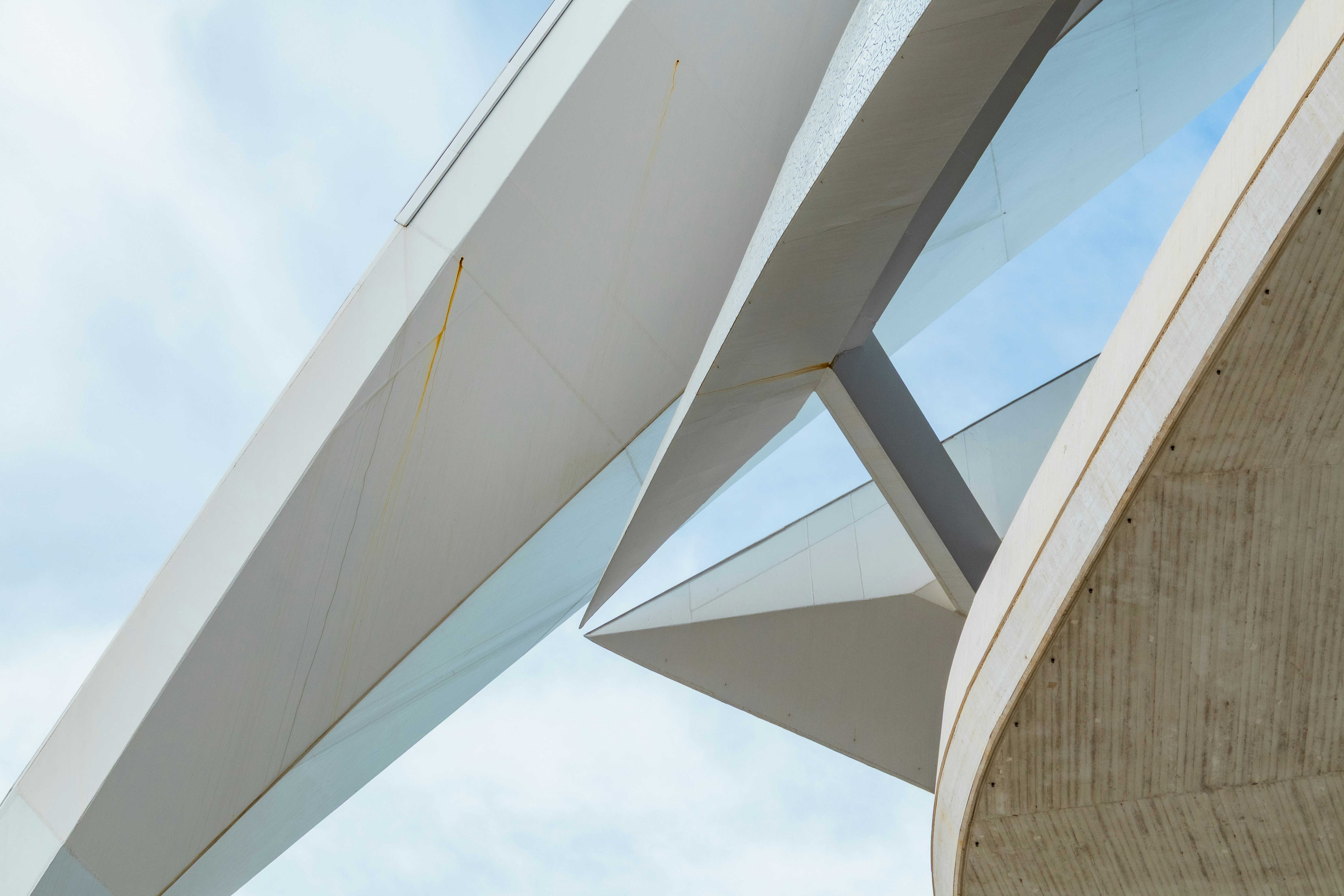 Modern architectural details against a cloudy sky
