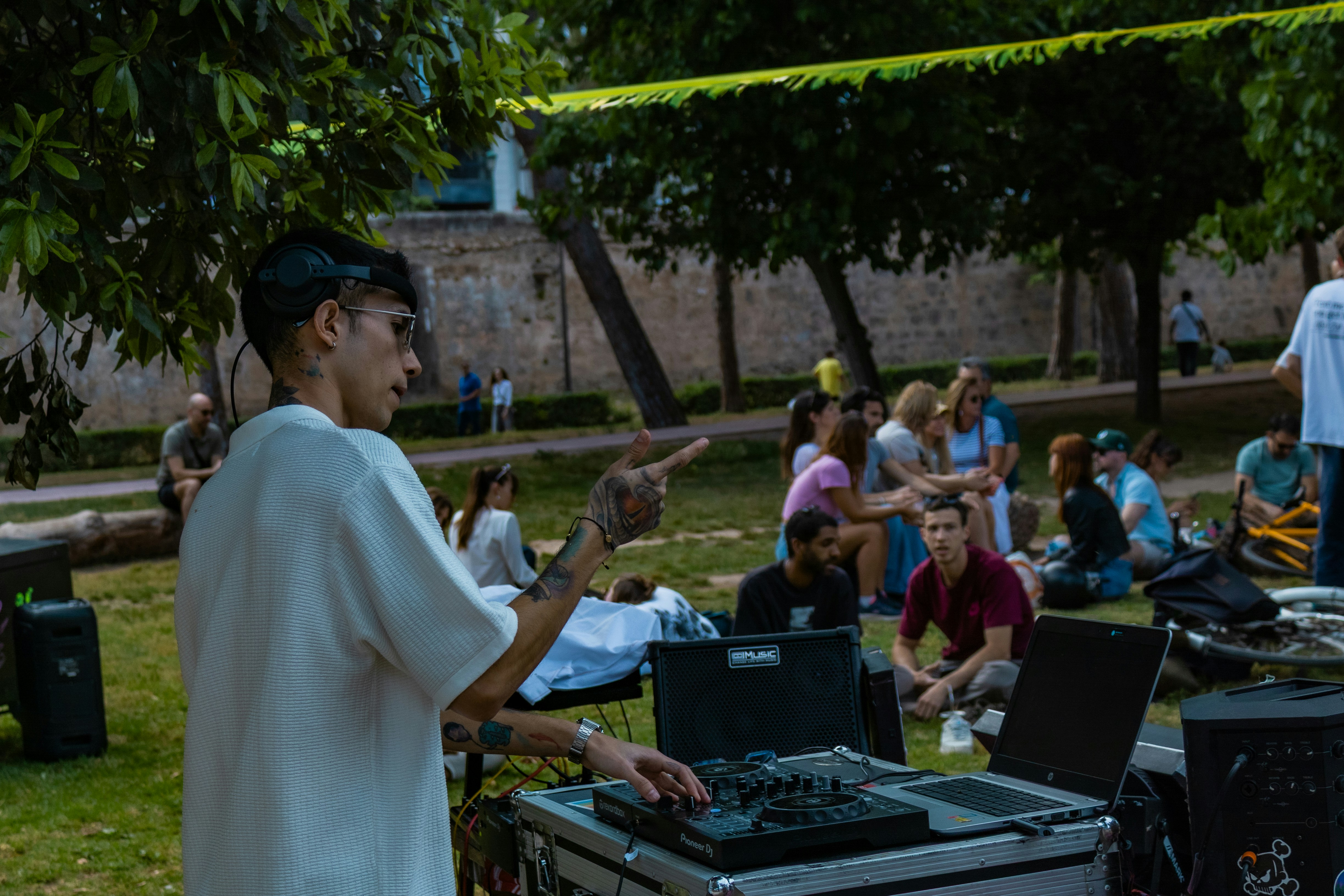 Dj playing music for an outdoor gathering