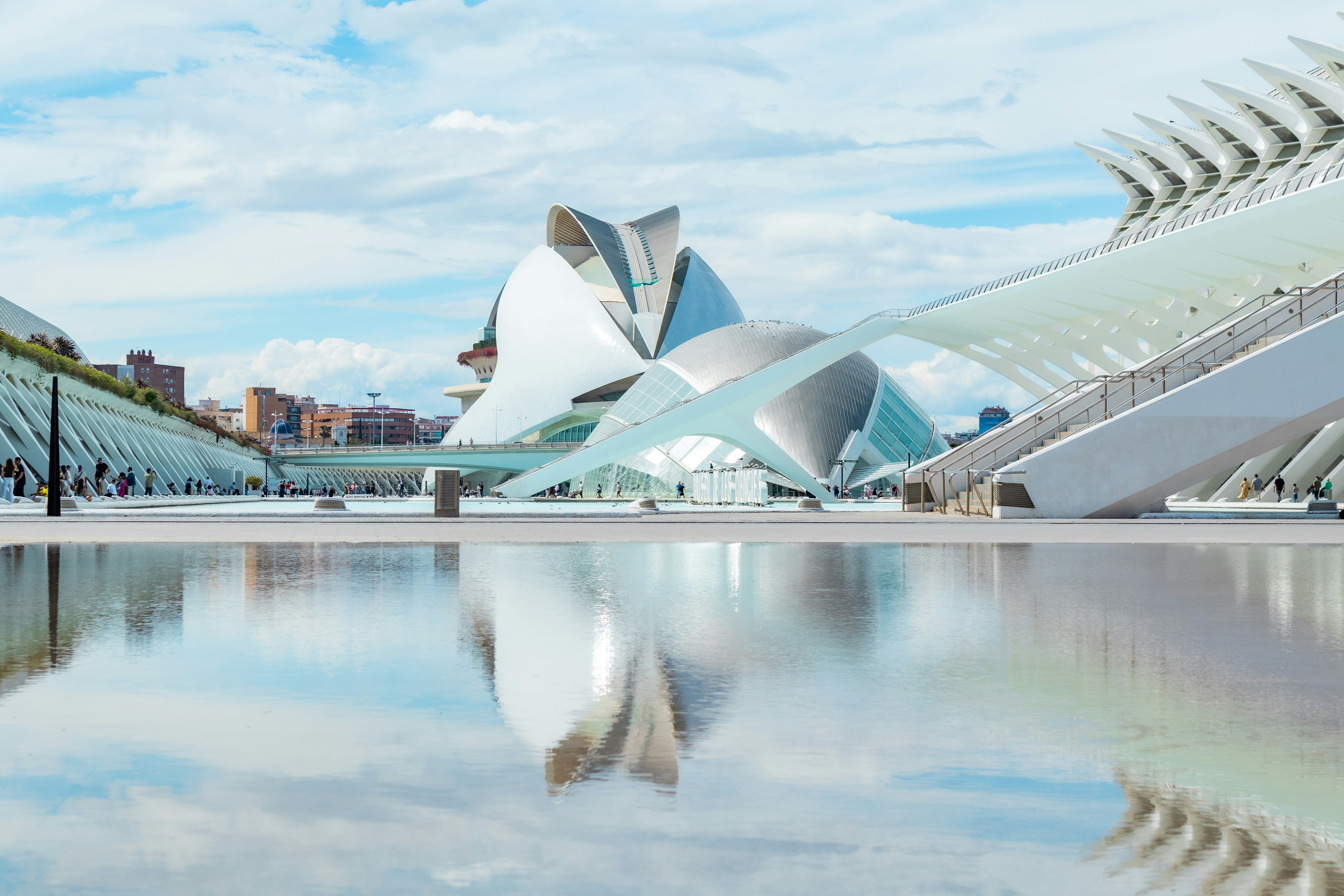 Modern architecture reflected in a calm water surface.