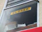 A yellow sign reads closed in a window