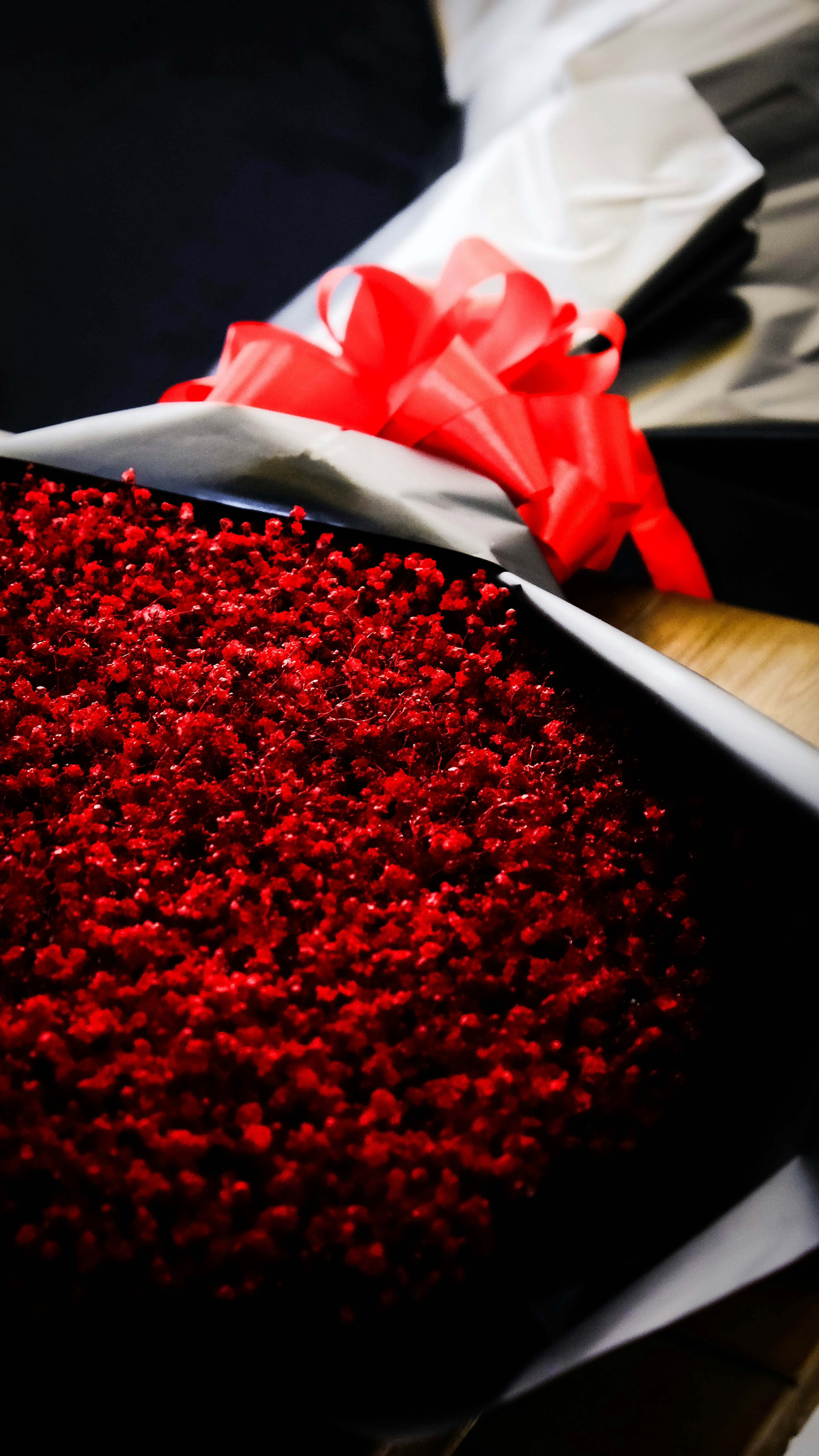 Red velvet cake with a red ribbon bow