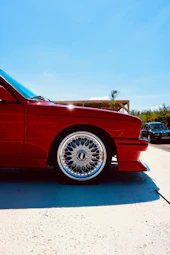Red vintage car with chrome alloy wheel