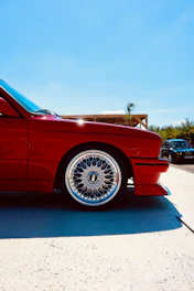 Red vintage car with chrome alloy wheel
