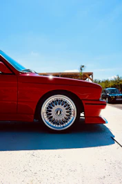 Red vintage car with chrome alloy wheel