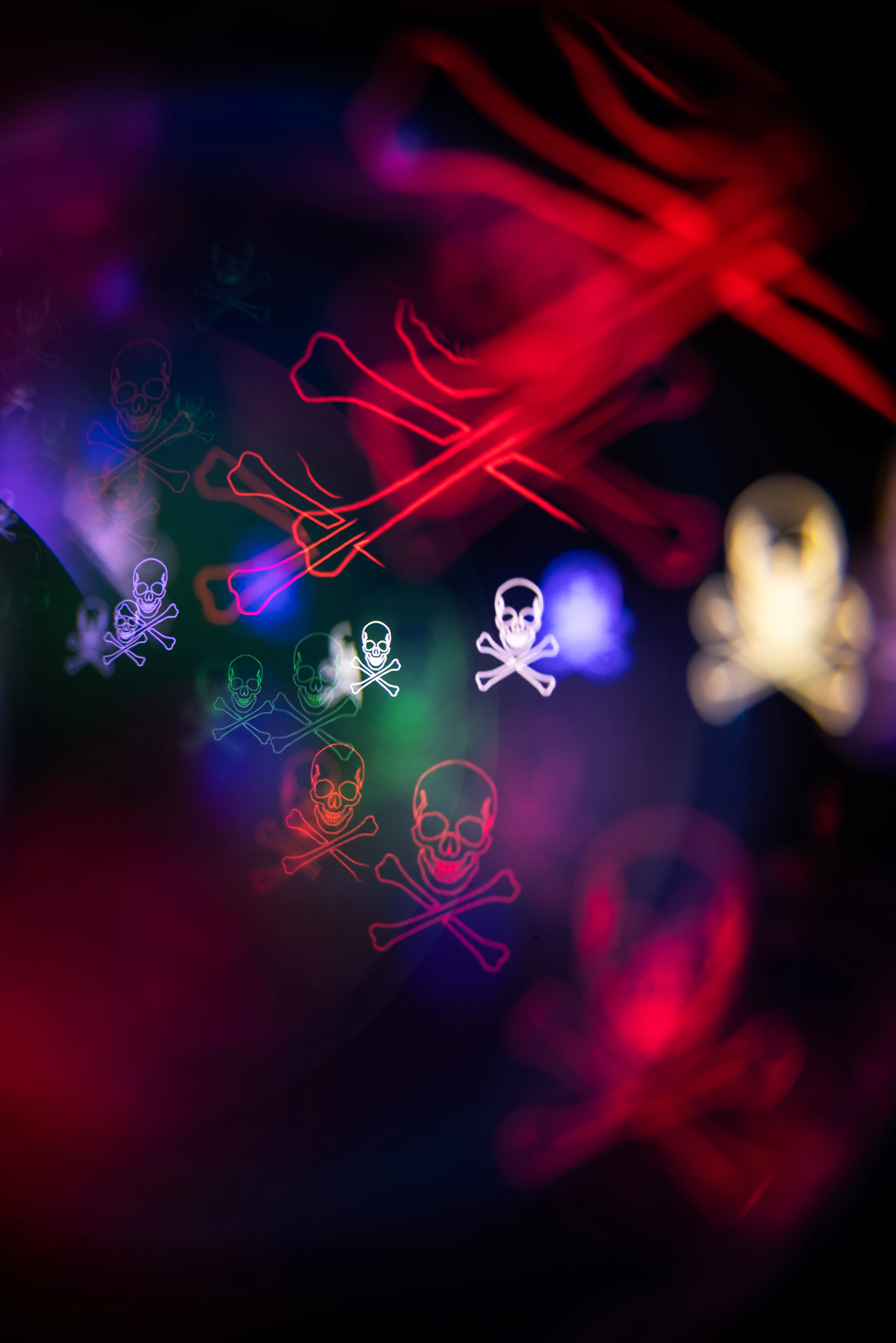 Abstract skulls and crossbones with colorful lights