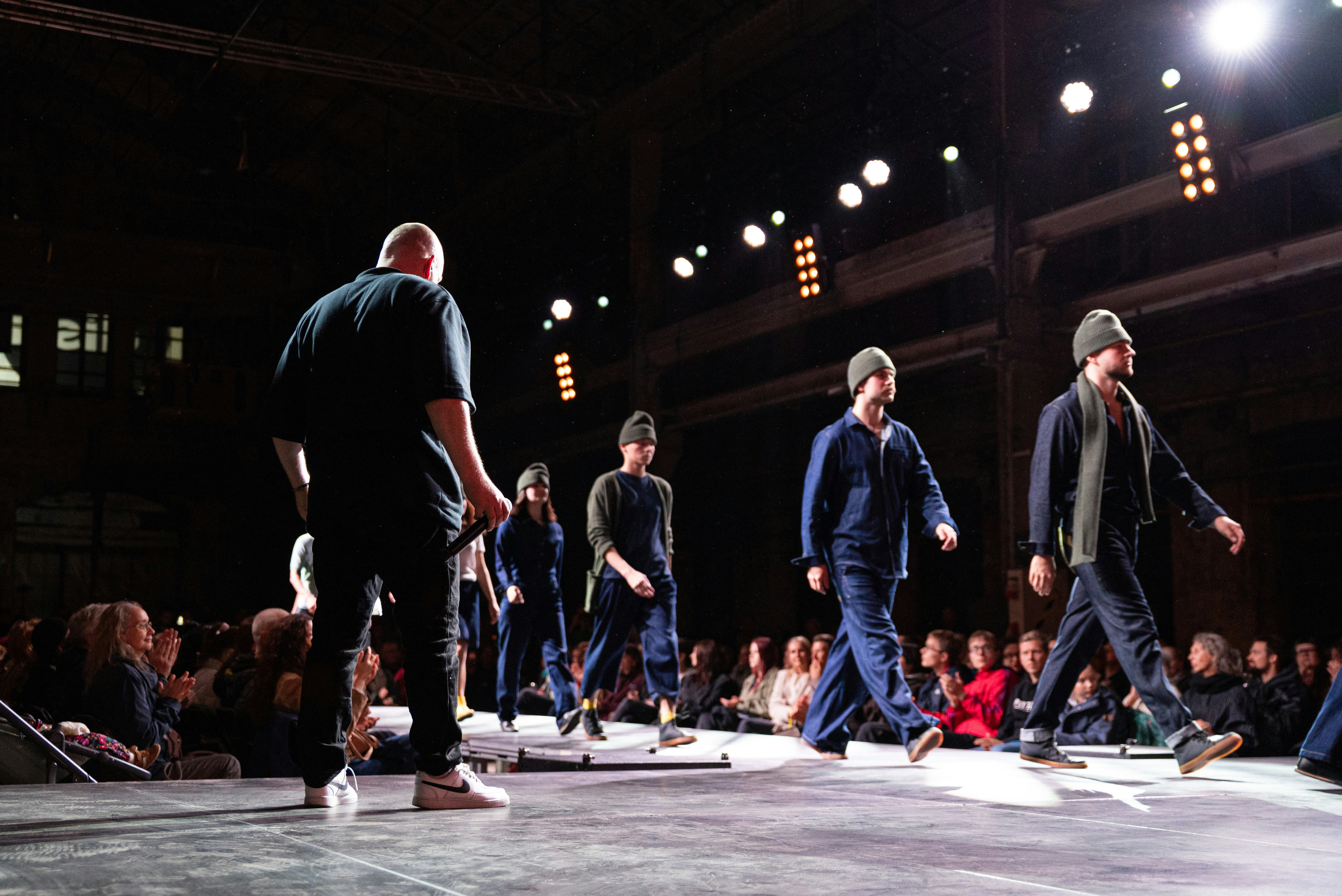 Models walking on a runway during a fashion show