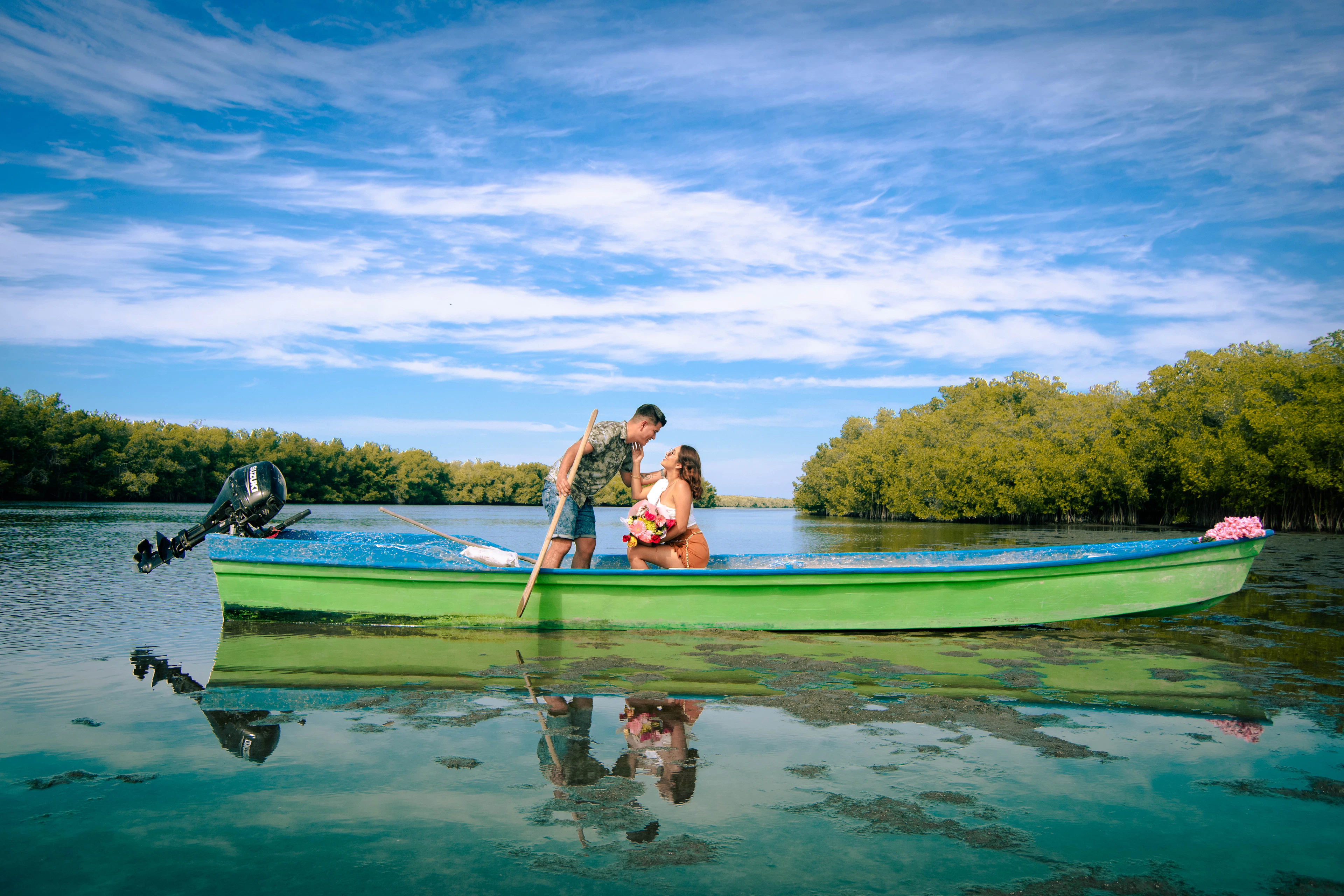 Couple enjoying a private boat ride on a calm Kerala lake