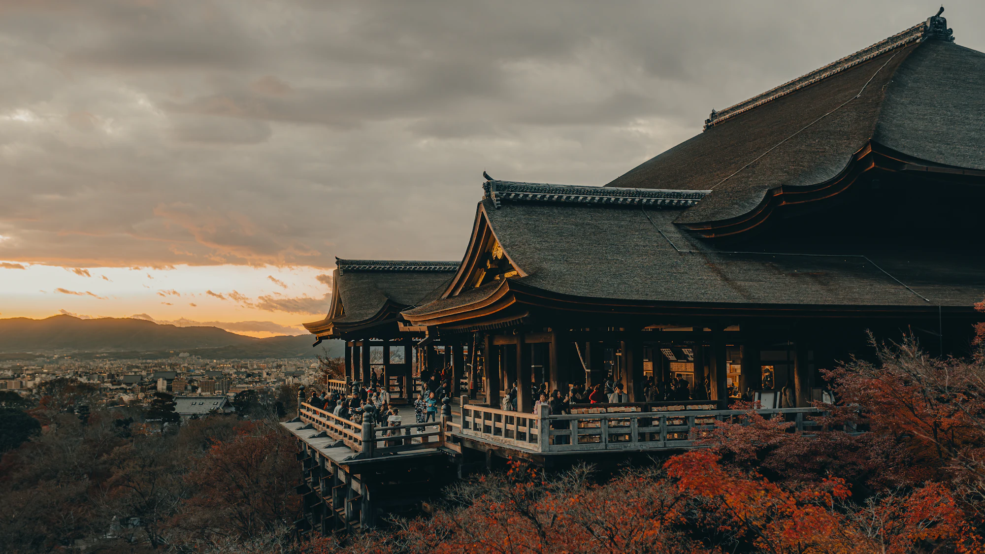 Kiyomizu-dera’s wooden terrace overlooking Kyoto near sunset.