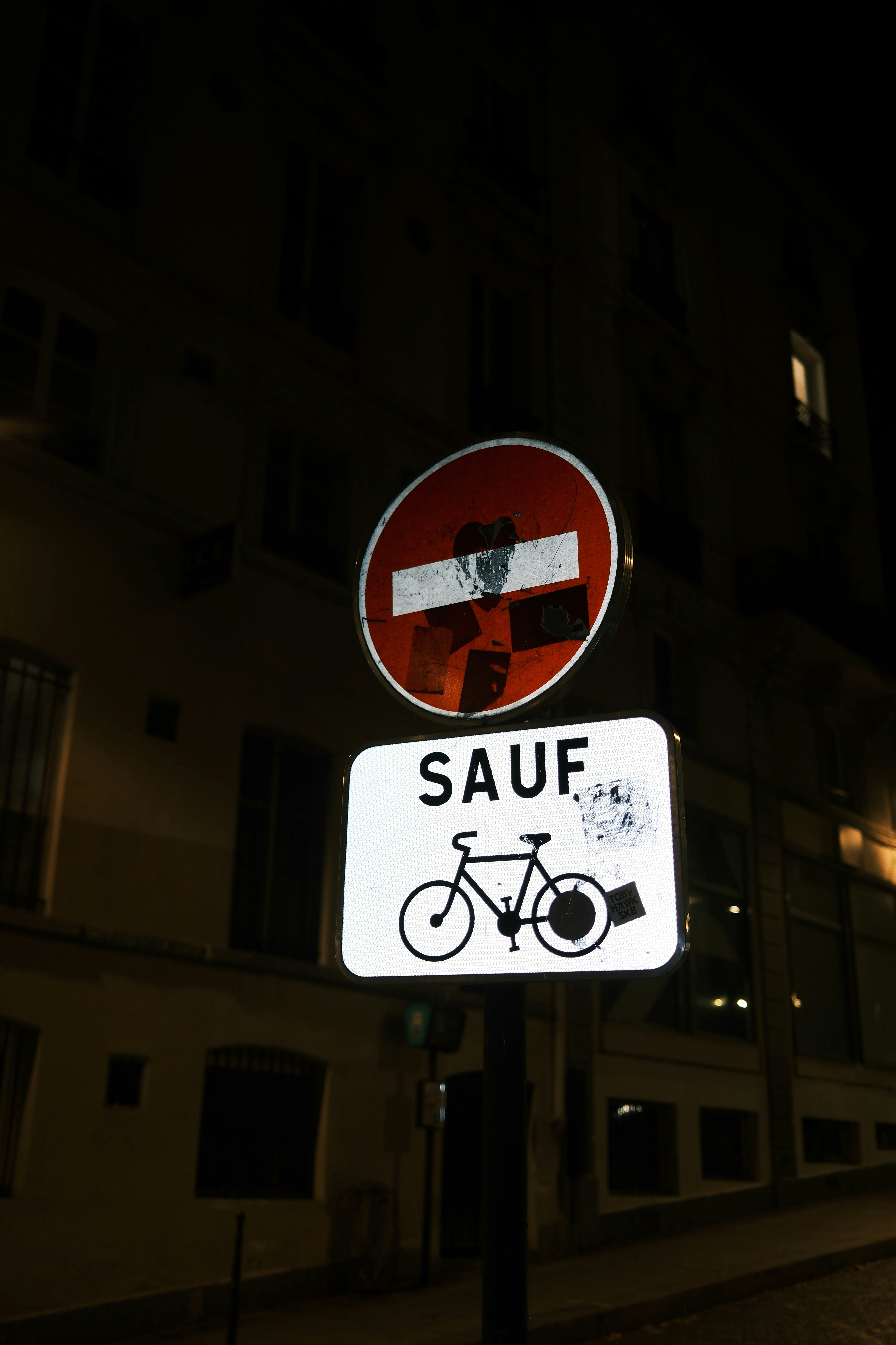 Street signs at night with building background building