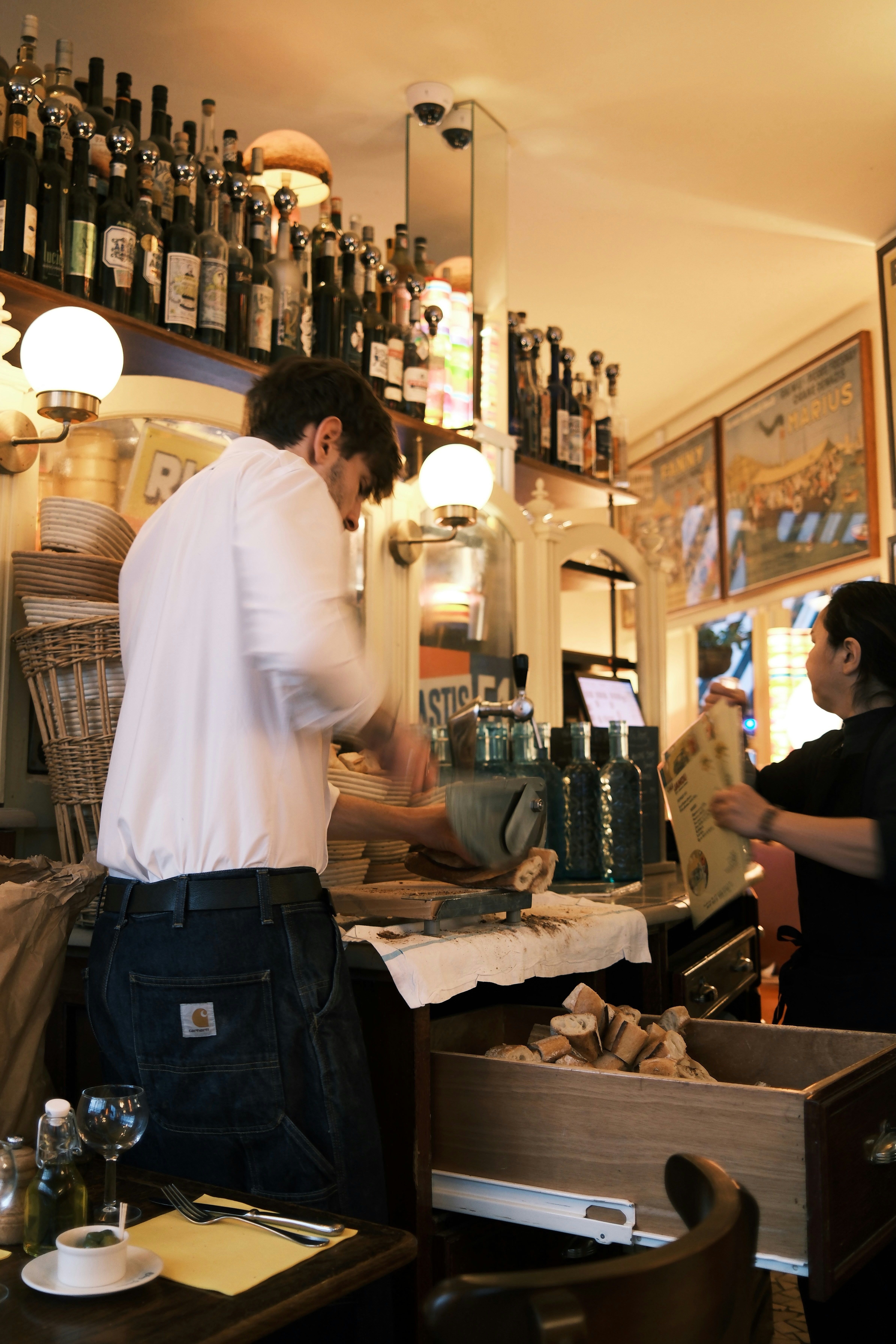 Bartender preparing drinks behind a bar