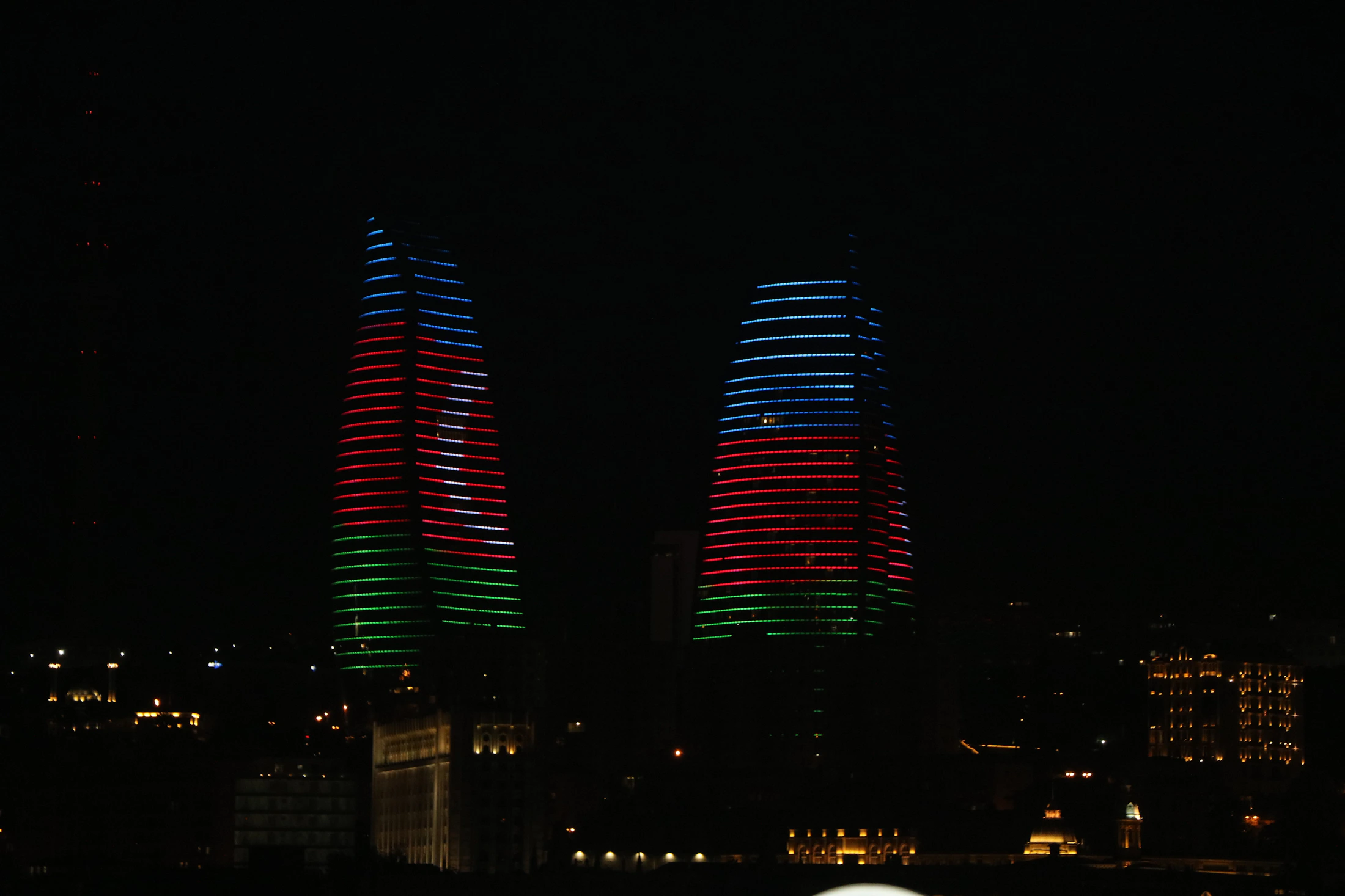 Flame Towers illuminated above Baku at night, Azerbaijan