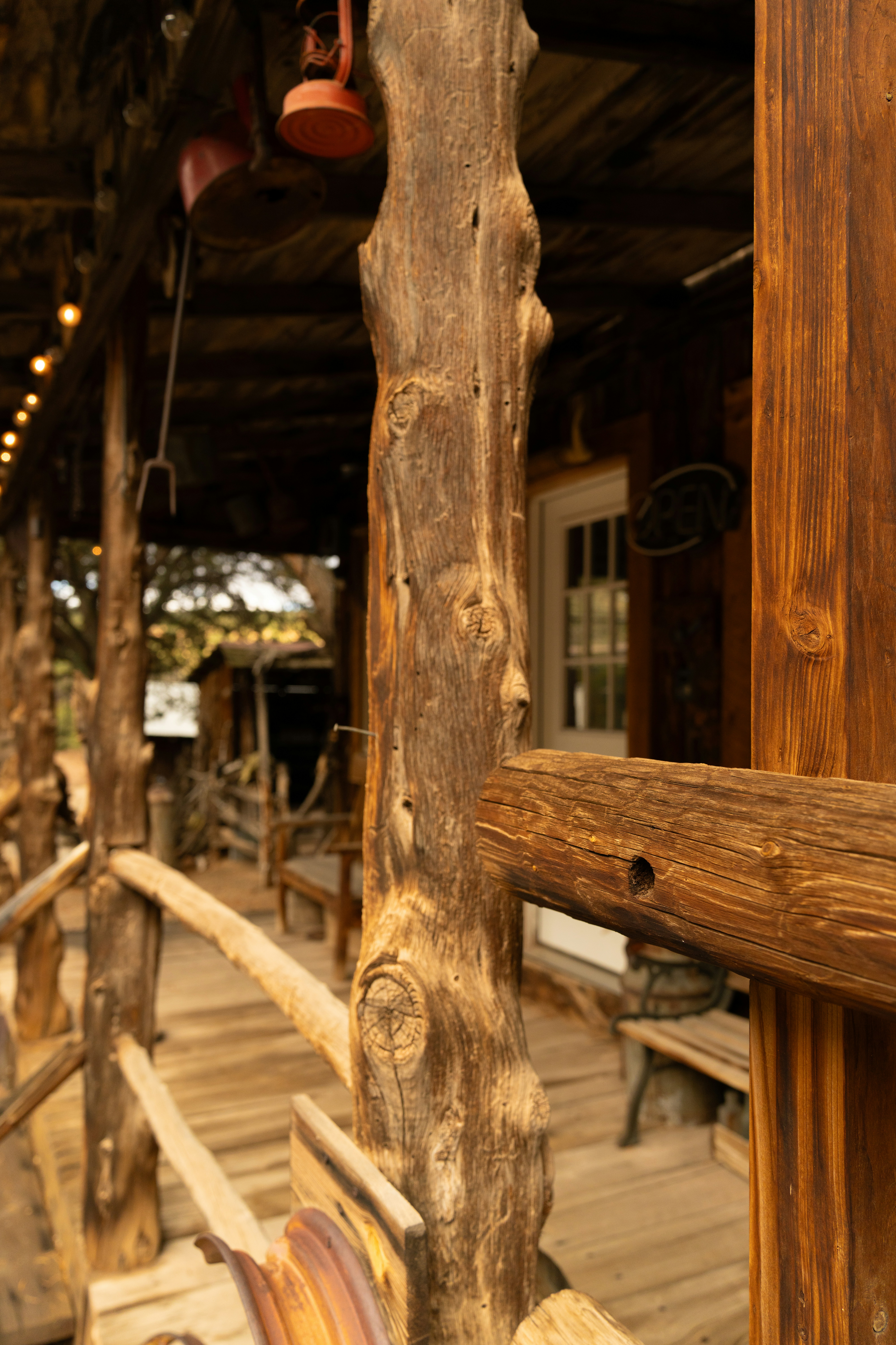 Rustic wooden porch with old lanterns and weathered elements