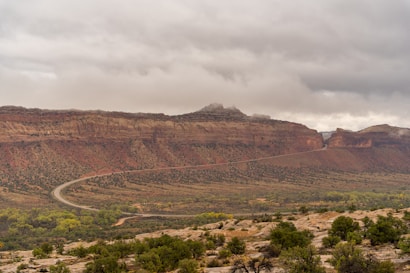 Winding road through a desert canyon landscape.
