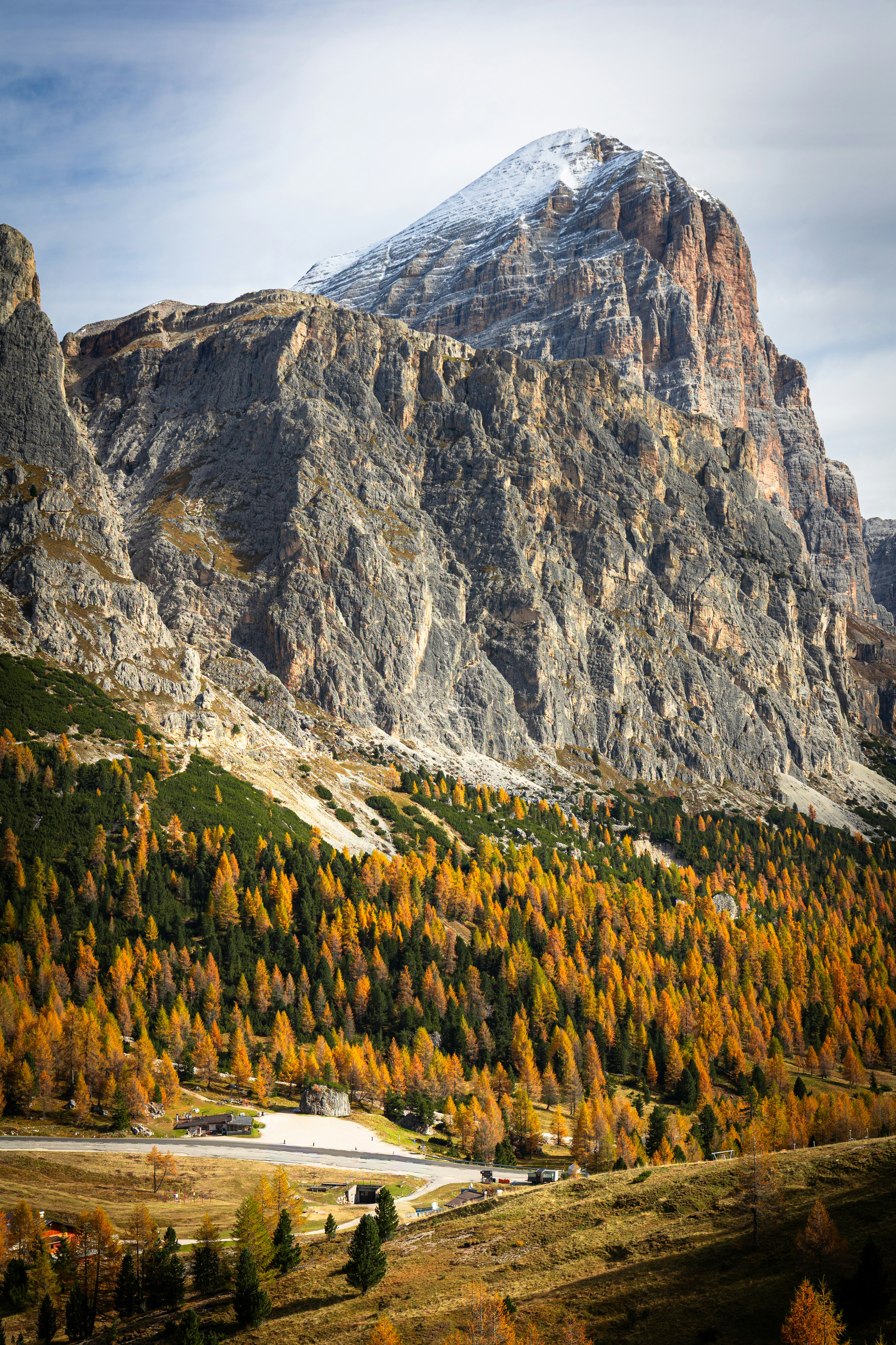 Majestic mountain peak with autumn forest below
